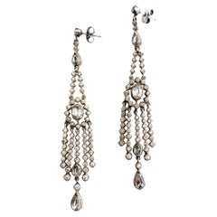Very long silver and clear paste articulated drop earrings, France, 1920s.