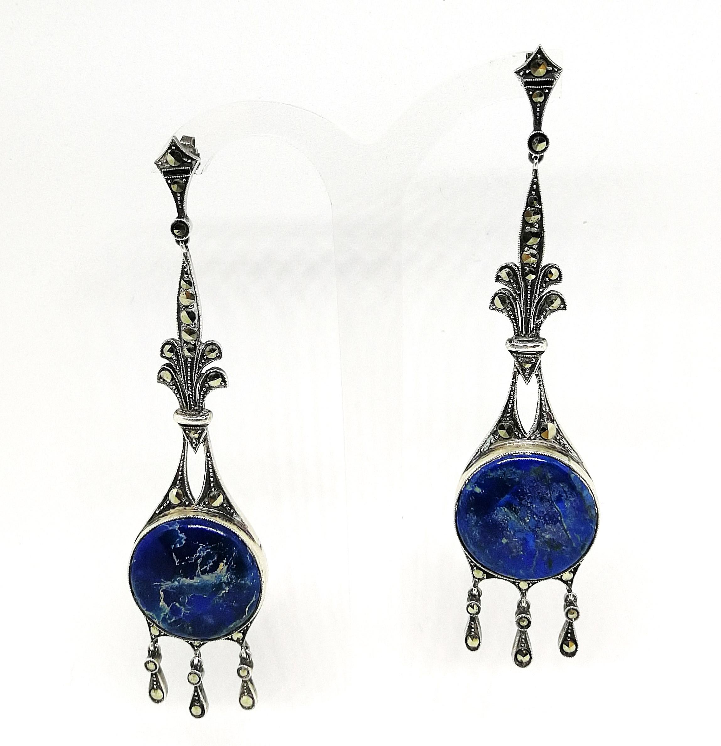 Very elegant, very long sterling silver and marcasite drop earrings, with a circular piece of sodalite/agate at their heart, these are unsigned as were many of the earrings of this period when set in sterling silver.. Classically 1920s, with that