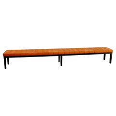 Very long wood and quilted cognac leather bench