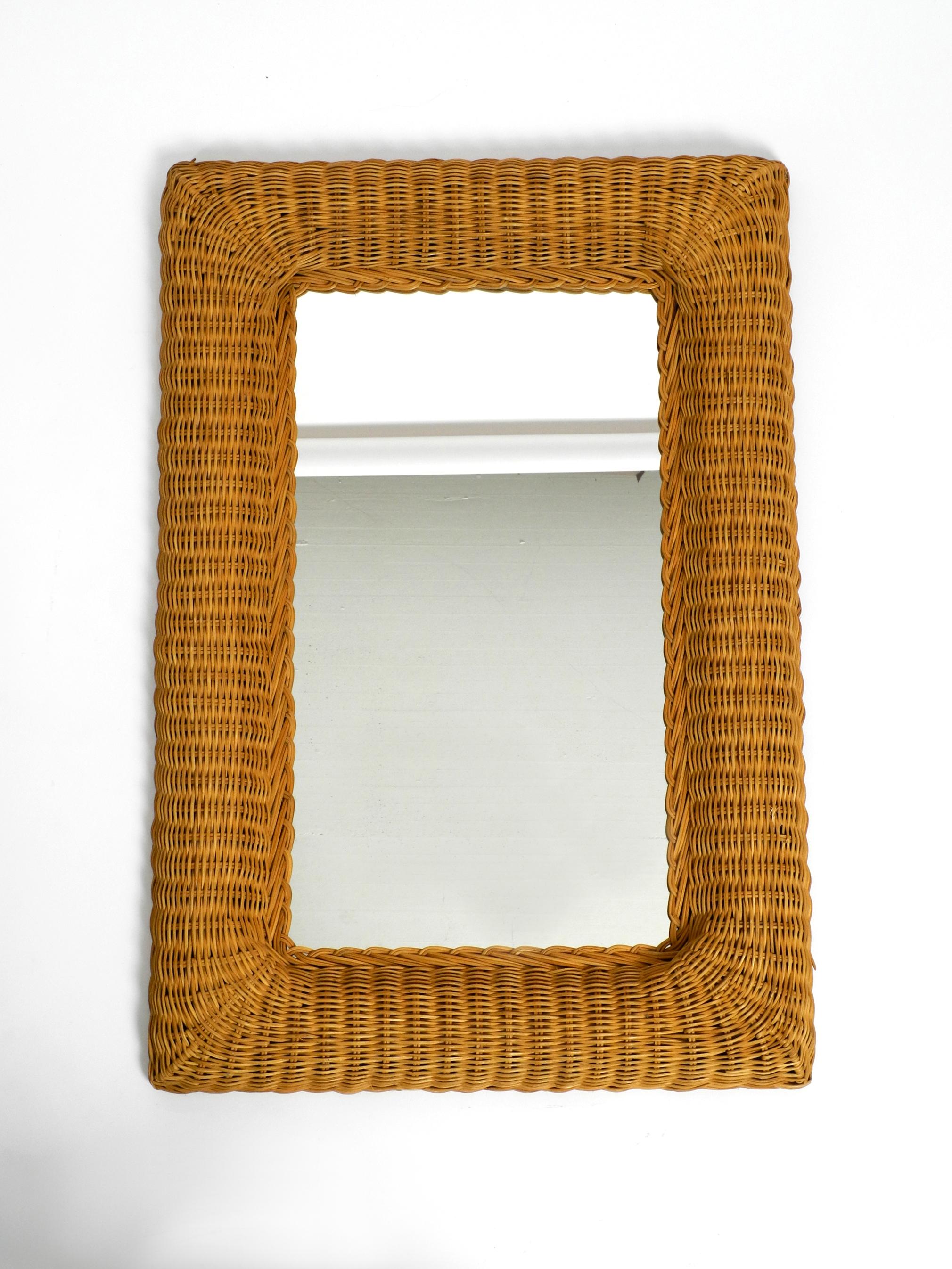 Beautiful rare large wall mirror with a wide frame made of wicker from the 1960s.
Frame on the back is made of two pieces wood.
Minimalistic very elegant design. Made in Italy.
Mirror is without damages. Not blind.
Just a few small fine blind