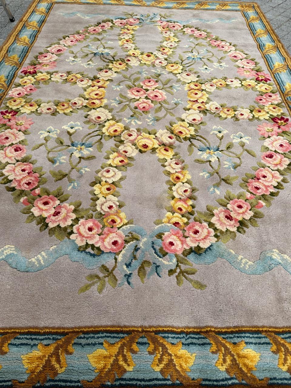 Presenting a regal masterpiece from the prestigious Beauvais manufacturing: an exquisite early 20th-century French Savonnerie rug. This royal treasure features intricate floral designs and a rich array of colors. Hand-knotted with wool velvet on a