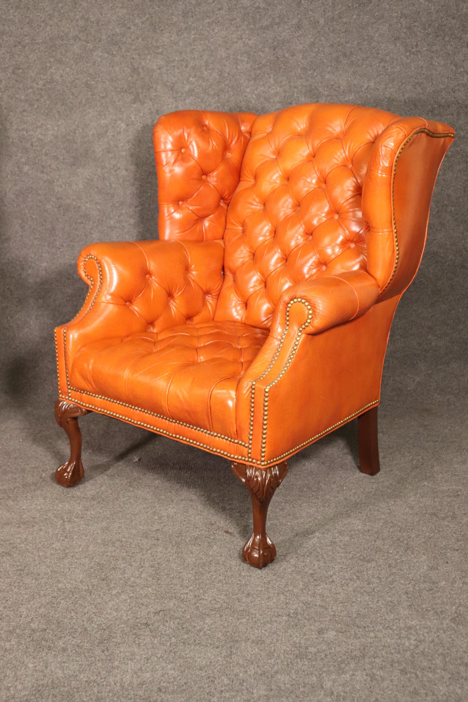 American Very Nice Pair of Orange Chesterfield Wing Back Chairs with one stool