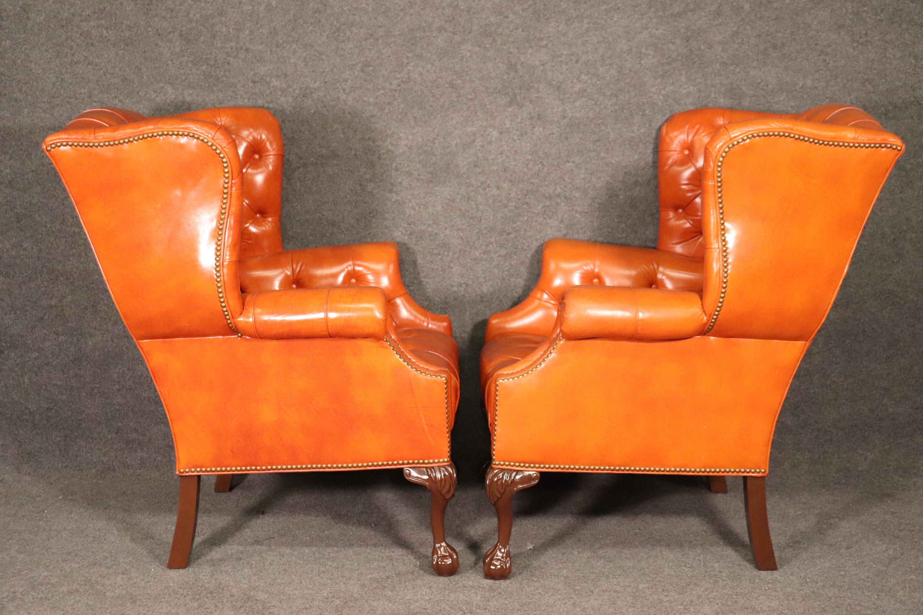 Mid-20th Century Very Nice Pair of Orange Chesterfield Wing Back Chairs with one stool