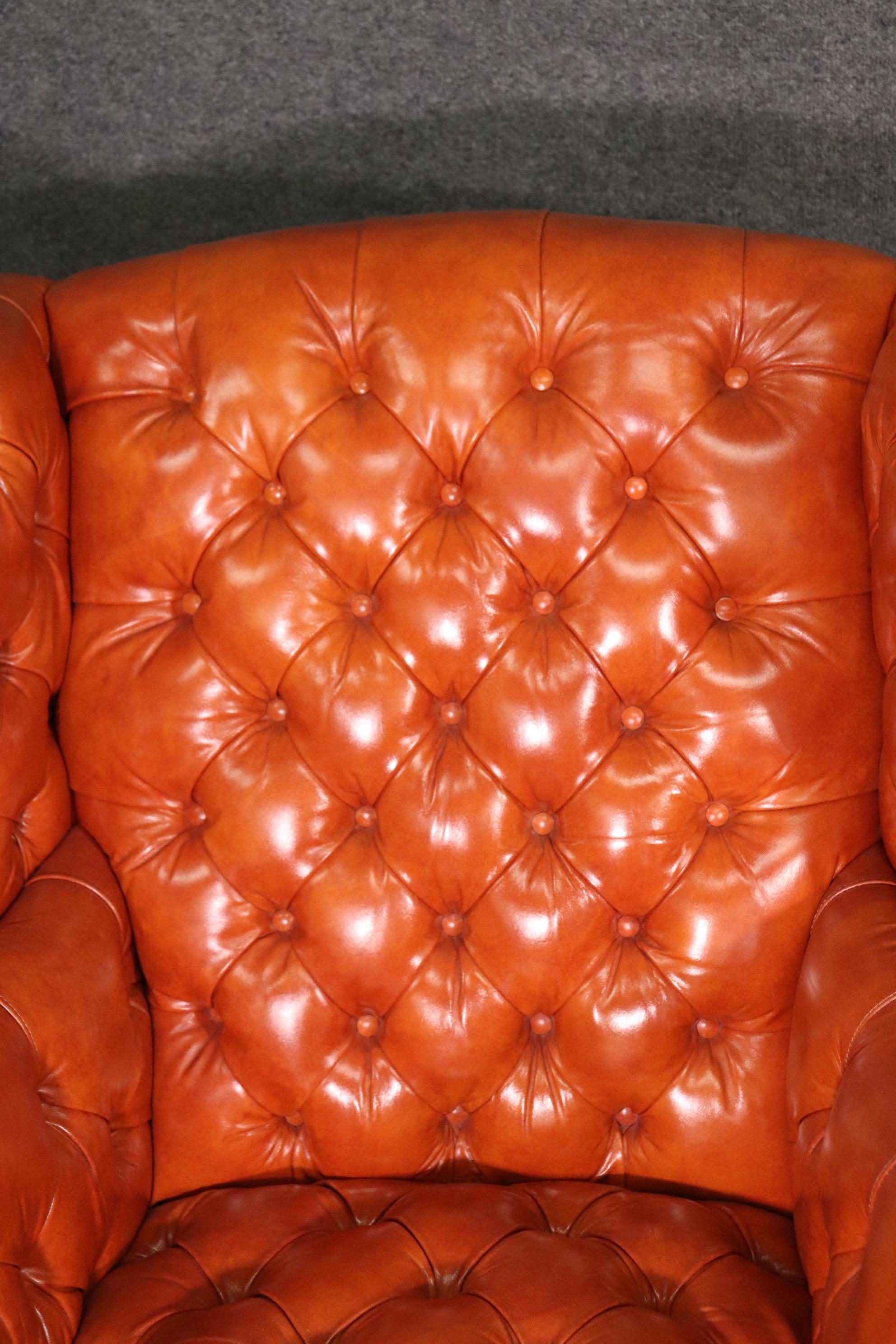 Very Nice Pair of Orange Chesterfield Wing Back Chairs with one stool 1