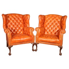 Very Nice Pair of Orange Chesterfield Wing Back Chairs with one stool