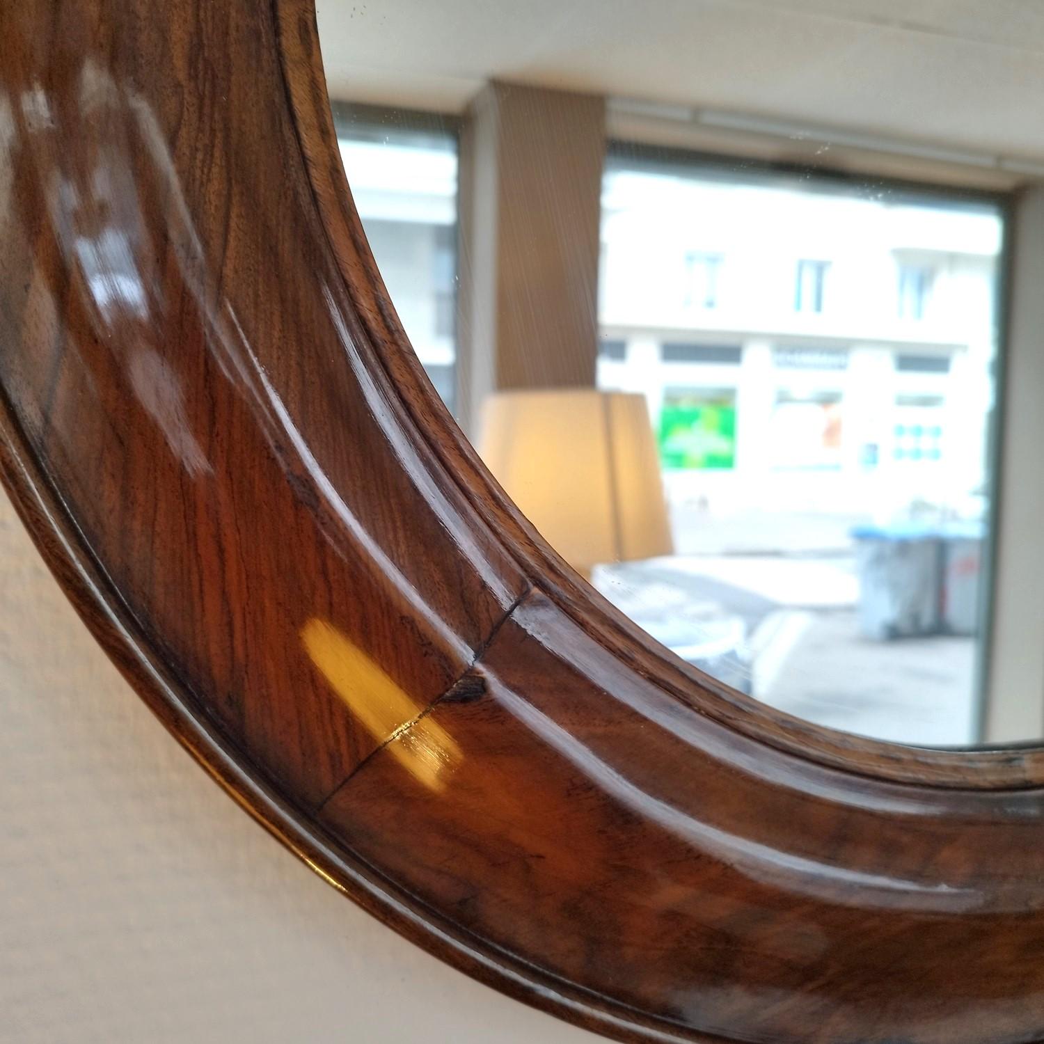 Very original Louis Philippe by its shape, which gives it a very 70's look. It's made of walnut, the mirror has been replaced, as well as the cover. It has a lovely finish with light golden color. It can also be placed vertically.