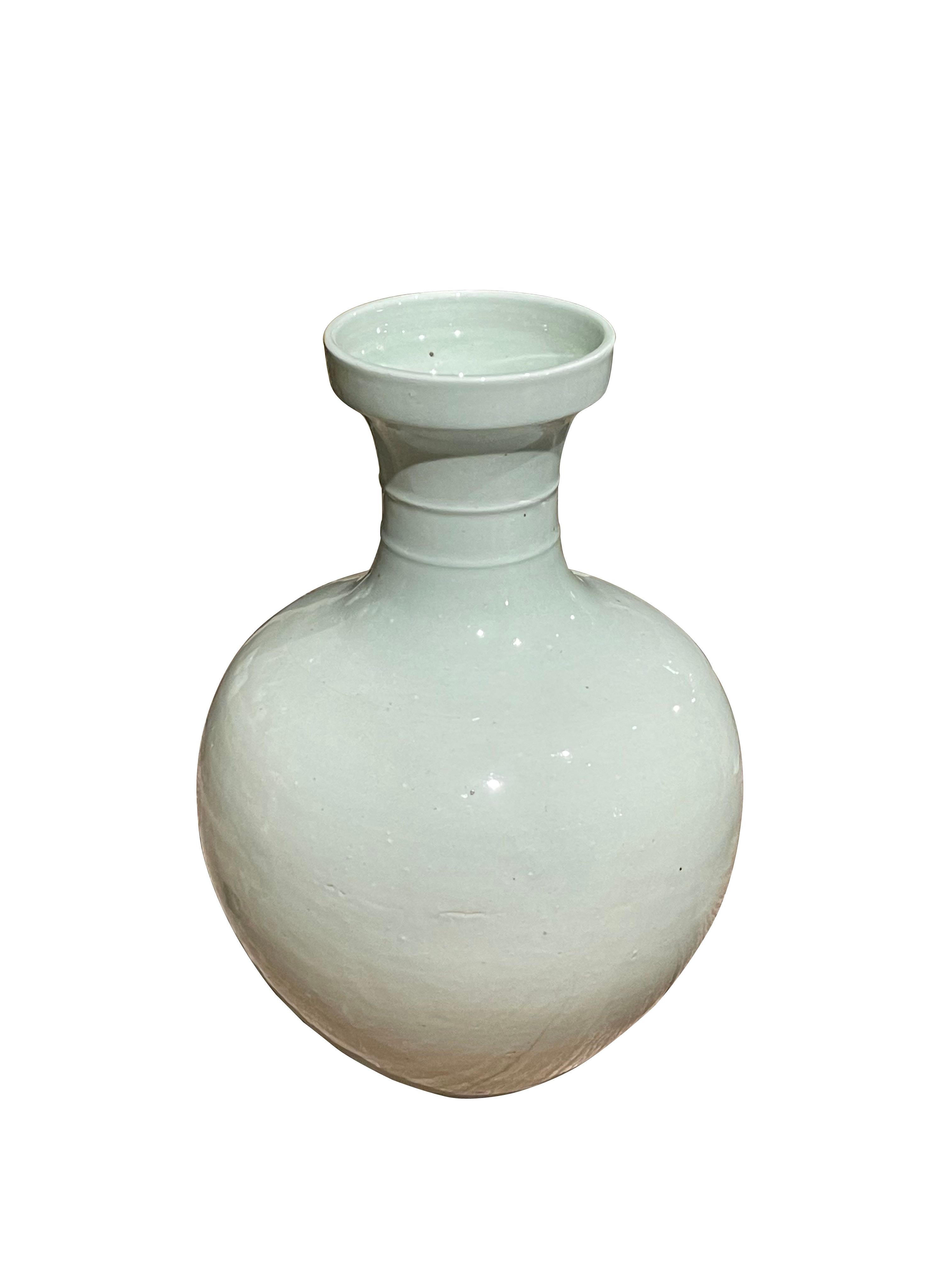 Contemporary Chinese very pale blue ceramic vase.
Decorative cup design at top and horizontal raised rib detail.
Also available in a larger size (S6236 ).
ARRIVING APRIL

