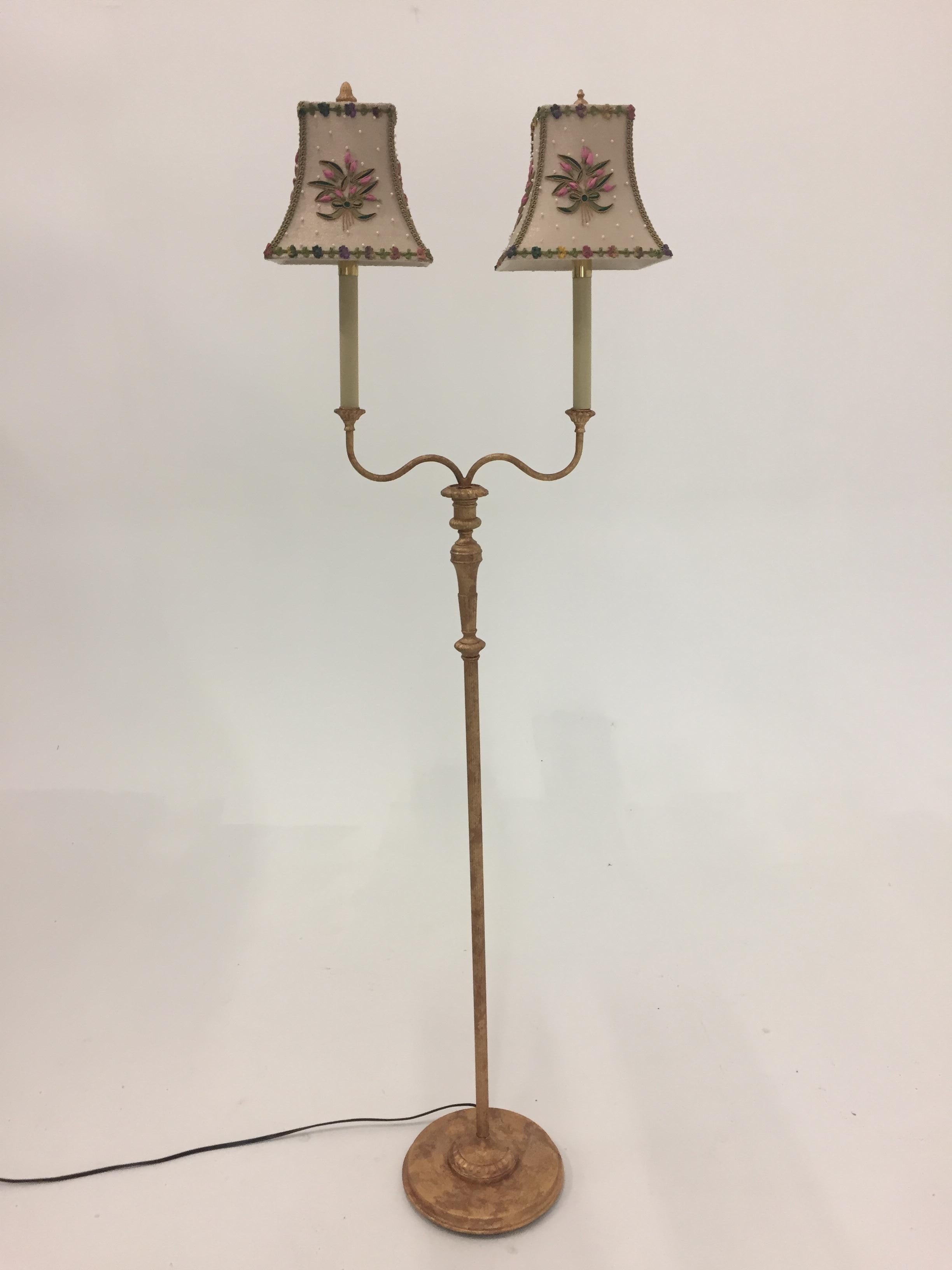 An elegant gilt metal designer floor lamp having round base and two candlestick arms, with very pretty custom hand embroidered shades.
By Raymond Waites for Tyndale