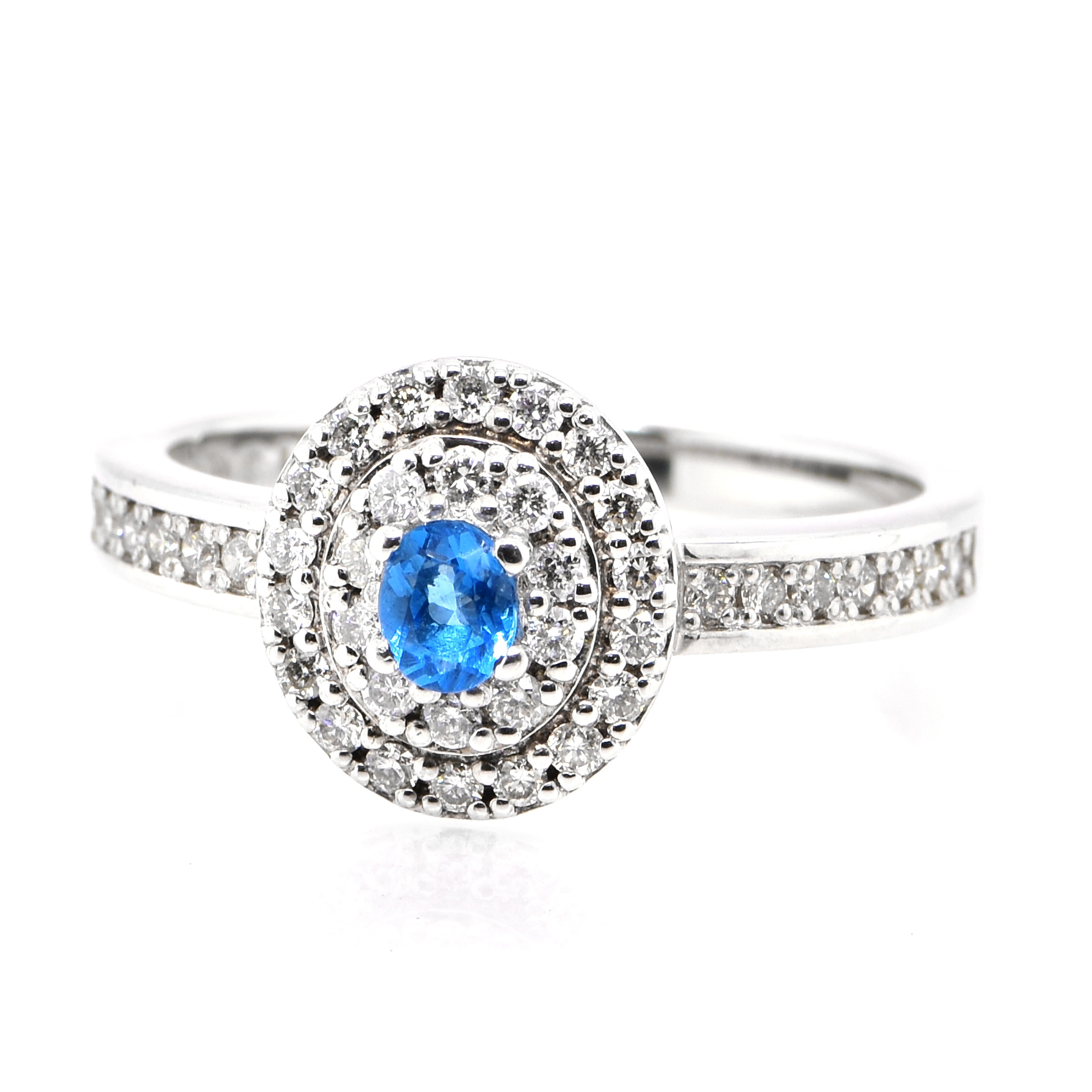 A stunning Engagement Ring featuring a 0.13 Carat Hauynite/Hauyne and 0.34 Carats of Diamond Accents set in Platinum. Hauynite is an extremely rare mineral and even rarer gemstone. Its bright blue color is common for this gemstone, but is can be