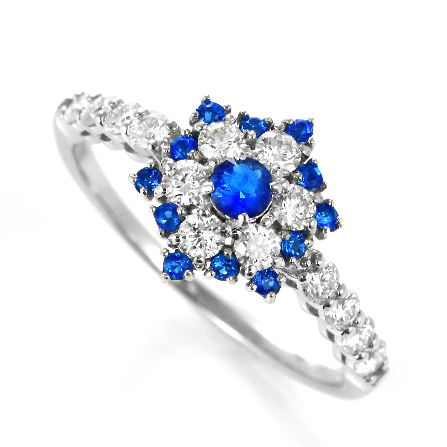 A stunning cluster ring featuring a 0.16 Carat Hauynite/Hauyne and 0.48 Carats of Diamond Accents set in Platinum. Hauynite is an extremely rare mineral and even rarer gemstone. Its bright blue color is common for this gemstone, but is can be also