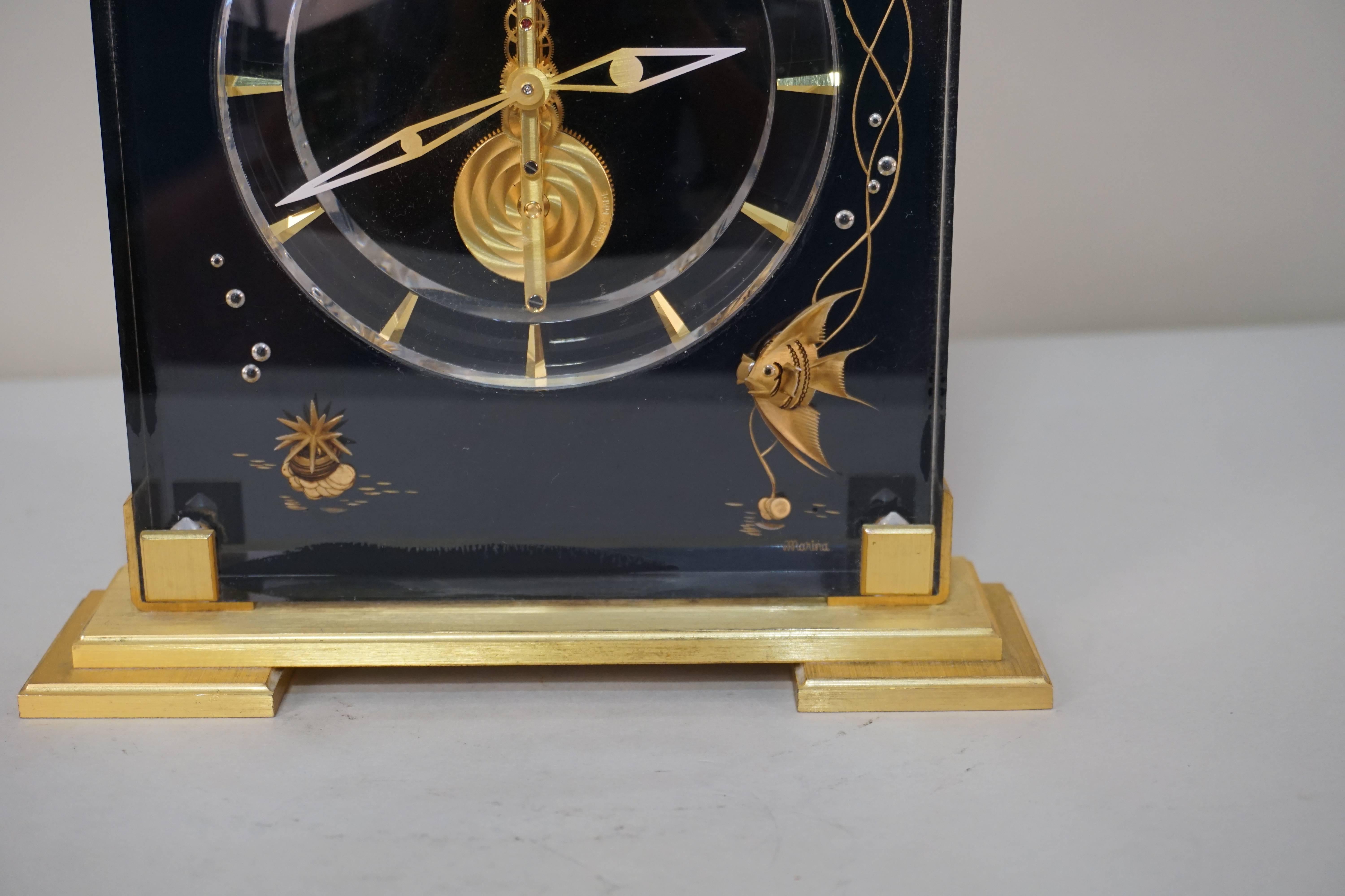 Exceptional Atmos Jaeger Le coultre aquarium in clear and black Lucite with the brushed gold plated bronze base mantel clock.