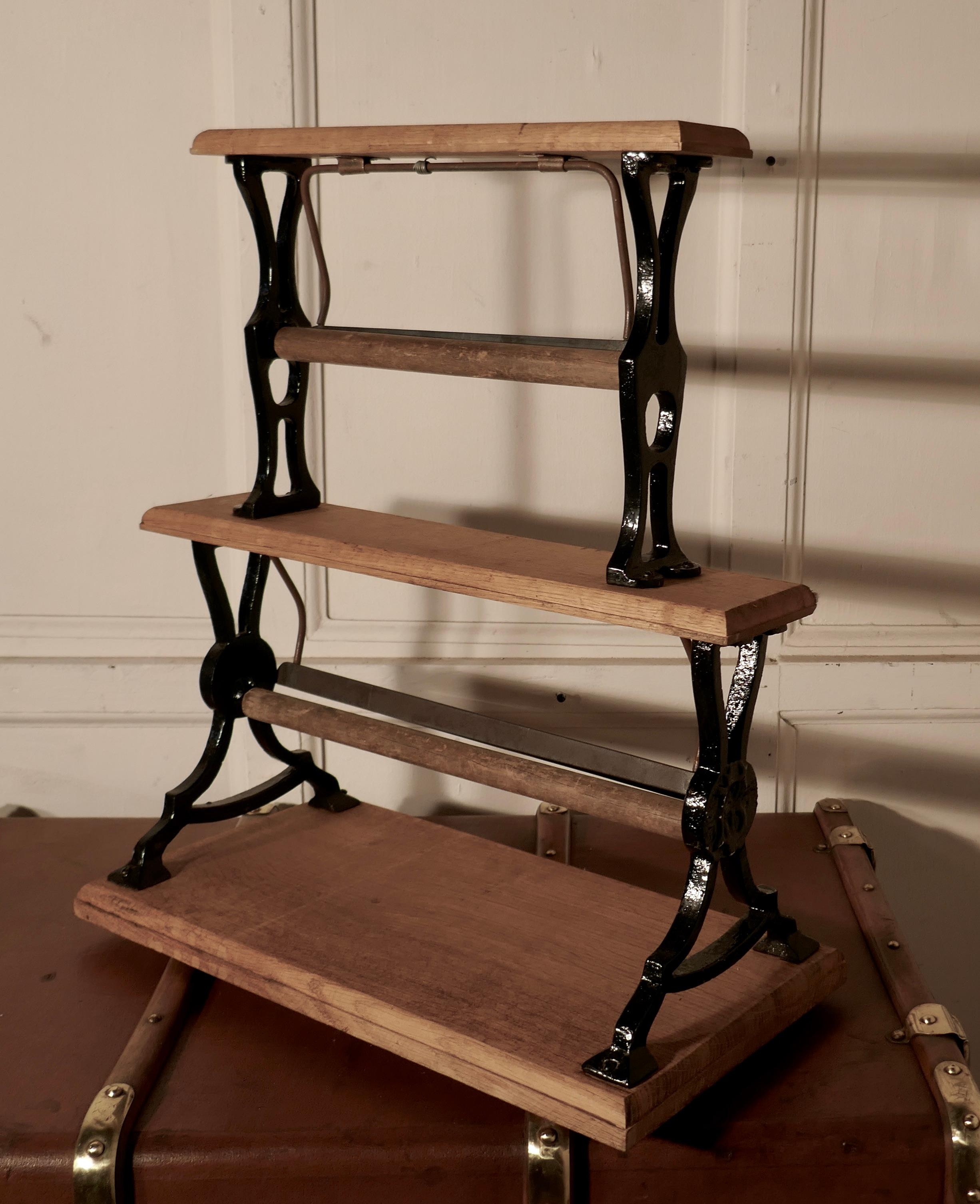 Very rare 19th century shop large double paper roll cutter

This is a rare and very unusual paper roll cutter, the stand is made in golden oak and iron, it holds 2 rolls of paper, the roll holders are set behind a heavy serrated cutting edge, so