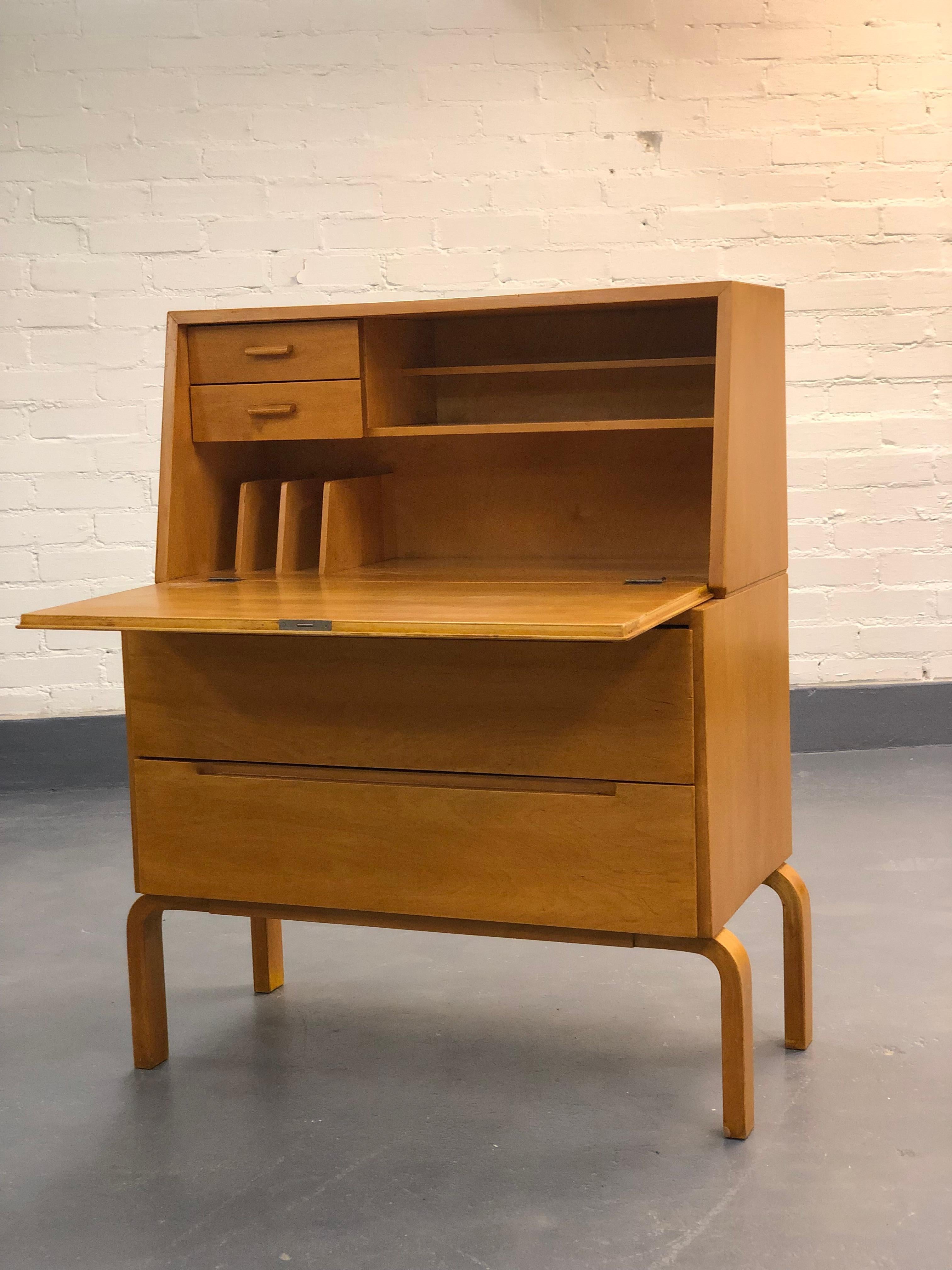 An exceedingly rare cabinet designed by Alvar Aalto. This item has sustained a great condition and has acquired a beautiful toned color in its lifespan of over 50 years. One of the best and rarest works of the world renowned architecture Alvar