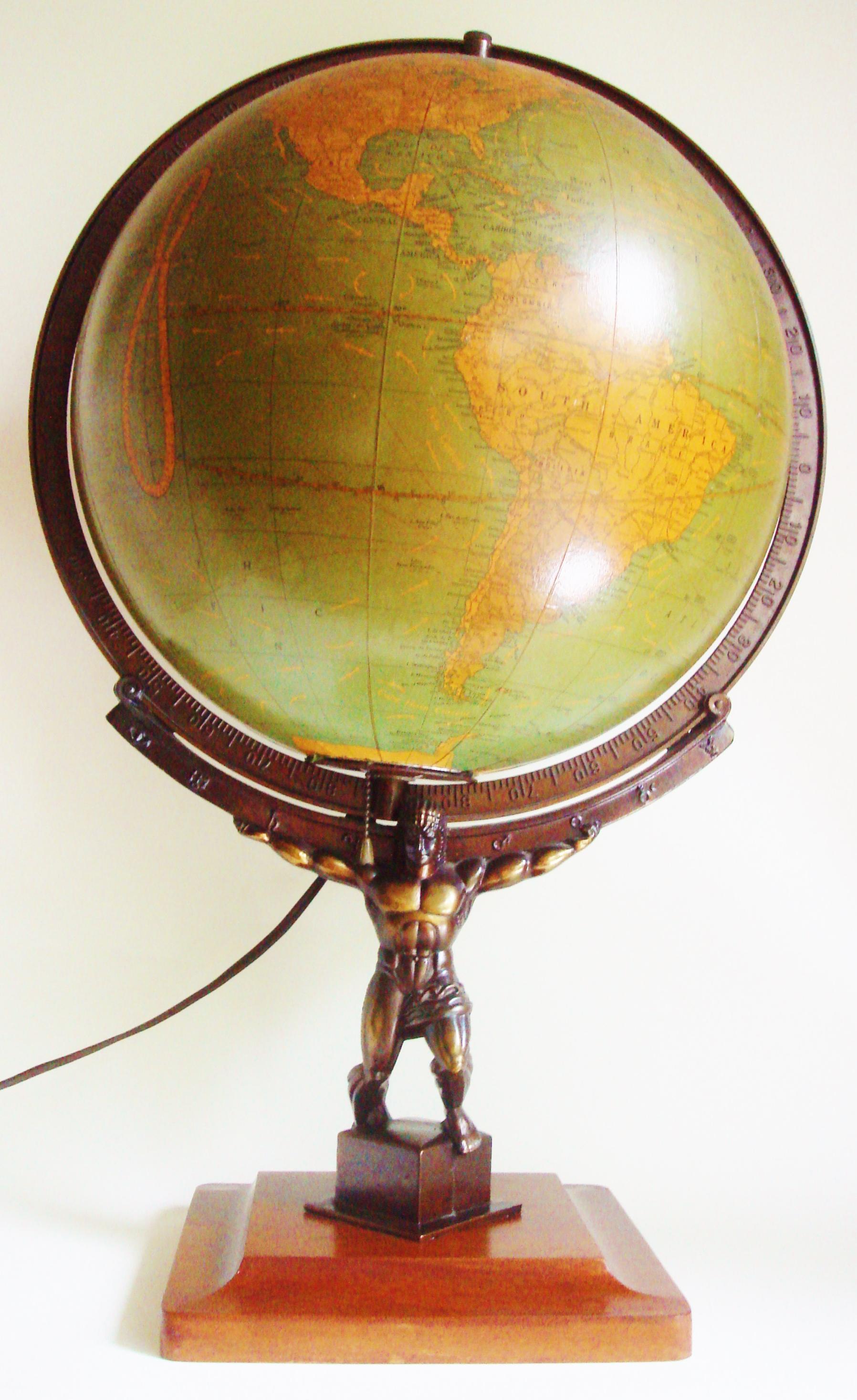 The design of this very rare example of the iconic illuminated figurative Atlas terrestial globe is based upon the 1937 Lee Lawrie and Rene Paul Chamberllan statue of Atlas in Rockefeller Plaza in NYC. This globe was introduced in 1949 by the George