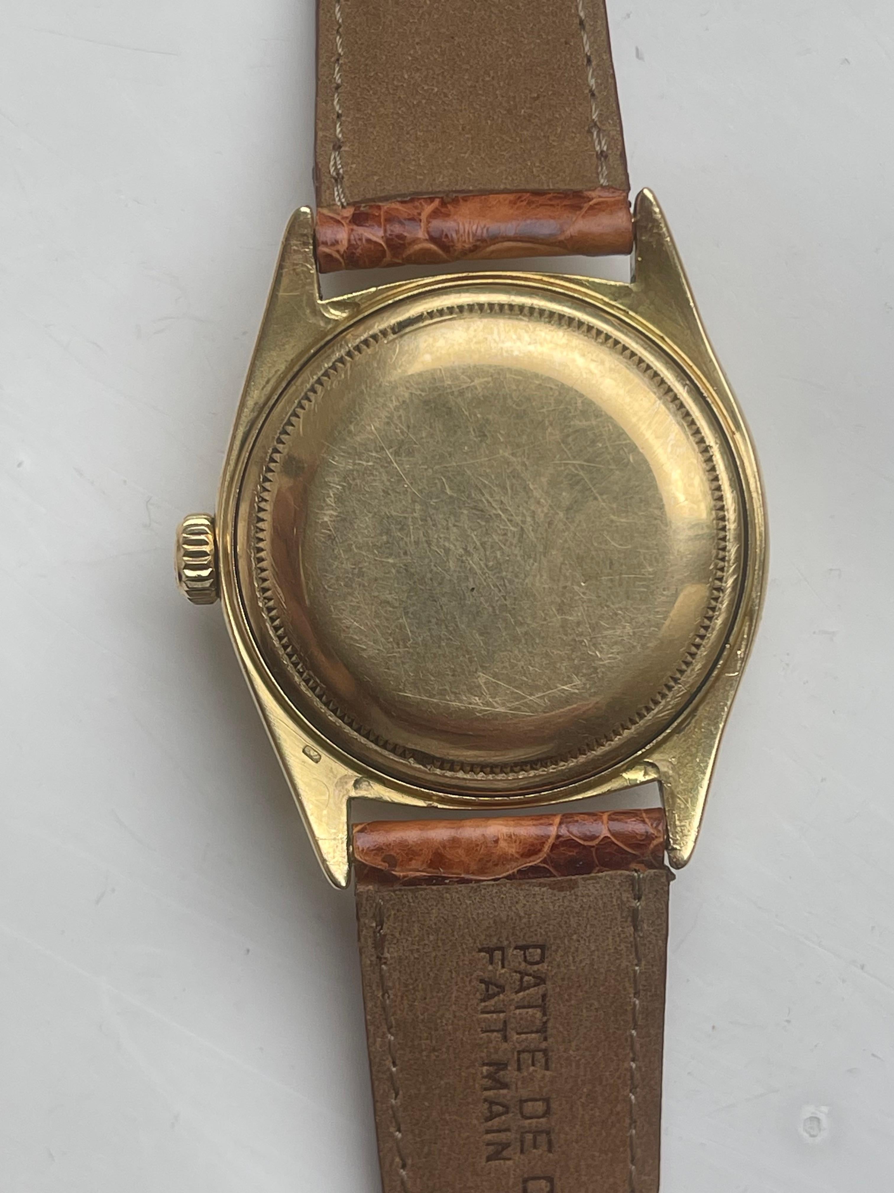 Very rare and early Rolex President with red Date 12