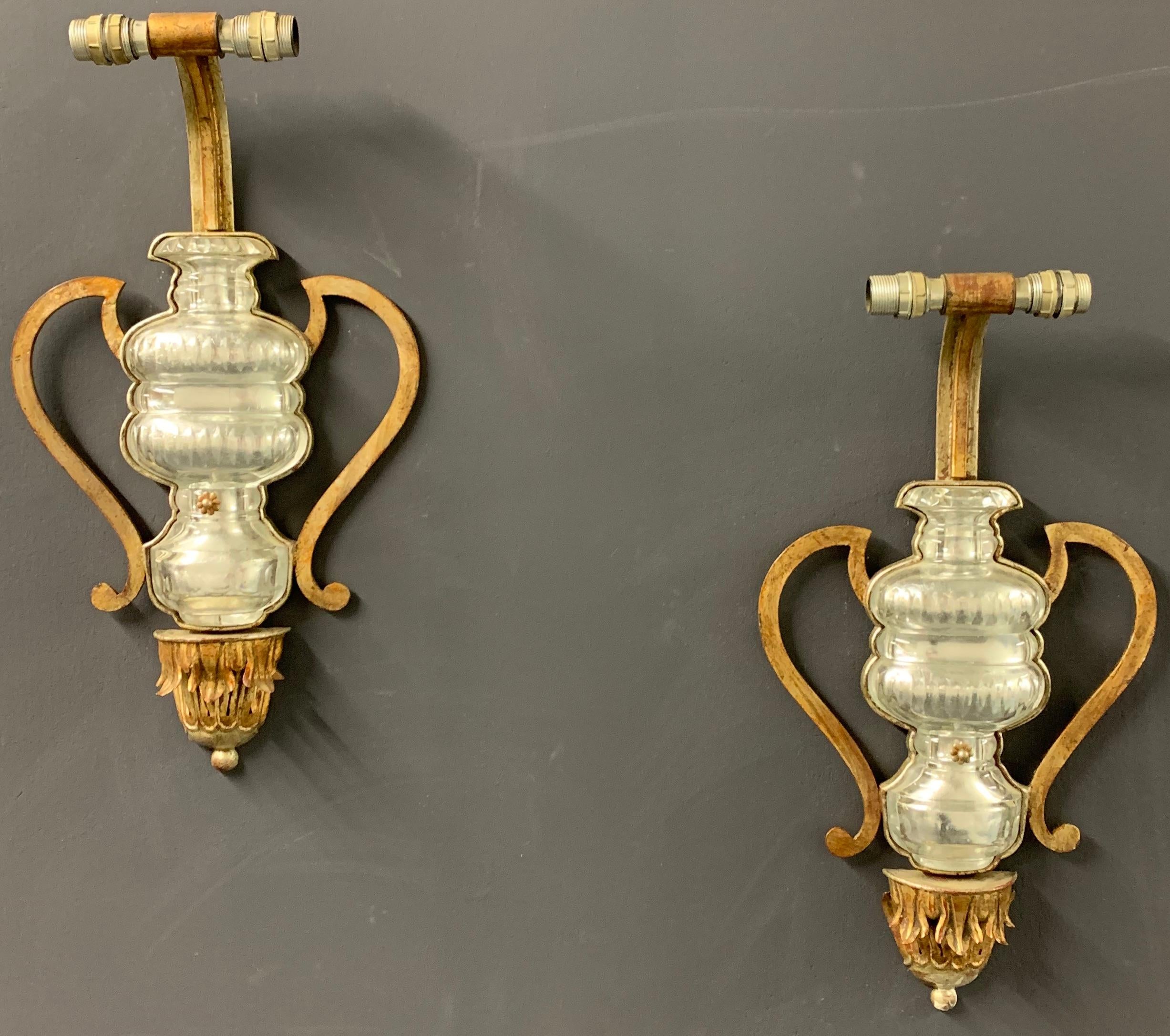 Huge wall lamps with gilt metal base and crystal glass elements.
