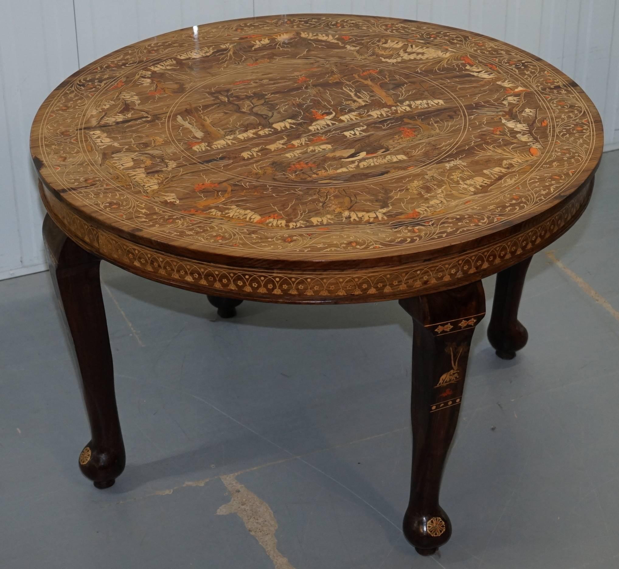 We are delighted to offer for sale this absolutely stunning Anglo Indian hand carved solid Redwood dining table depicting Elephants

This table is a dour de force of carving, every single piece of detail you can see has been hand carved and