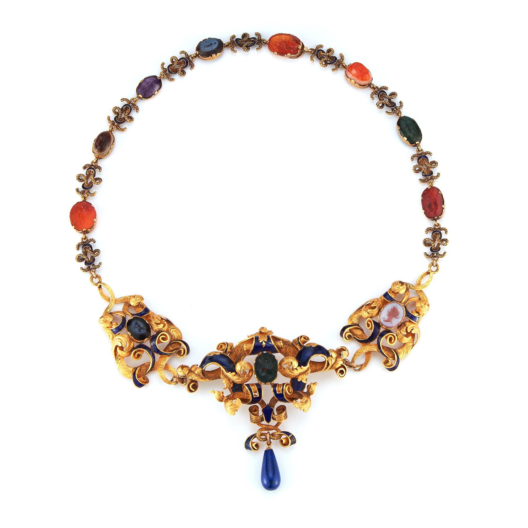Very Rare Antique Carved Intaglio Enamel Necklace

Multi Gem intaglios in numerous hardstones (carnelian, bloodstone etc),  with enamel accents set in 14K yellow gold.

Made circa 1900

Measurements: 15.75