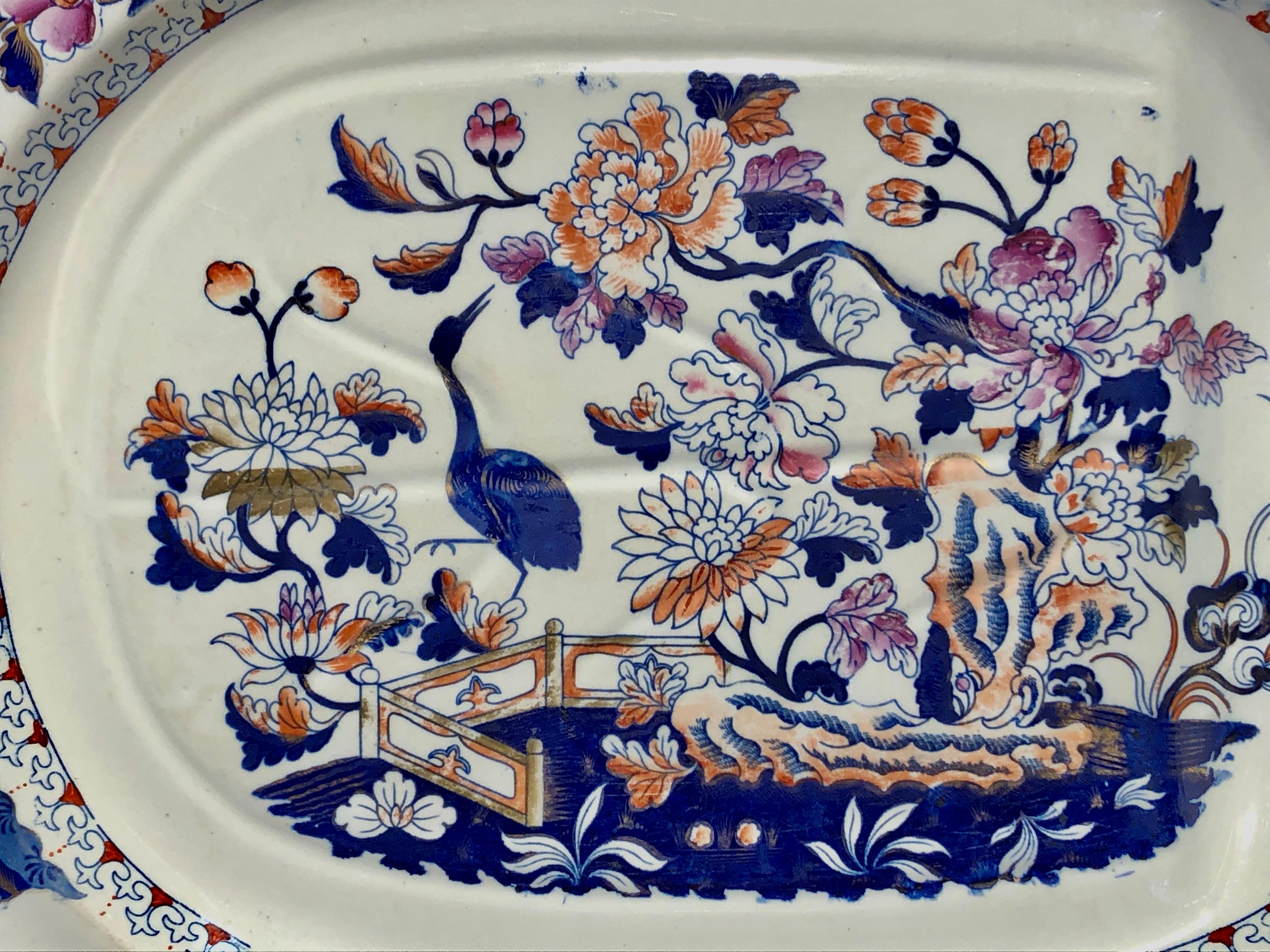 Magnificent and large antique English Geo. III large ironstone well and tree platter with gorgeous
Hand painted imari decor bird and floral design.
With very rare impressed maker's marks for Raplh & James Clews, Cobridge-Staffordshire
This