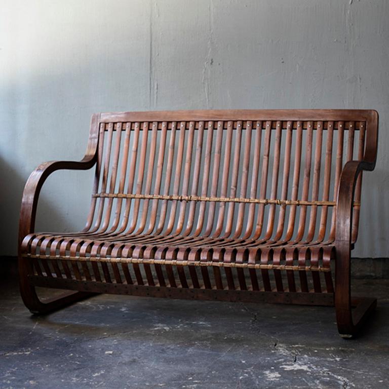 Ubunji Kidokoro Bamboo Bench
1930s, Japan
Designed by Ubunji Kidokoro and manufactured by Chikkosha.

Very rare variety of his chairs made with bamboo.
Good condition.
Charlotte Perriand who visited Japan in 1940 designed some bamboo furniture