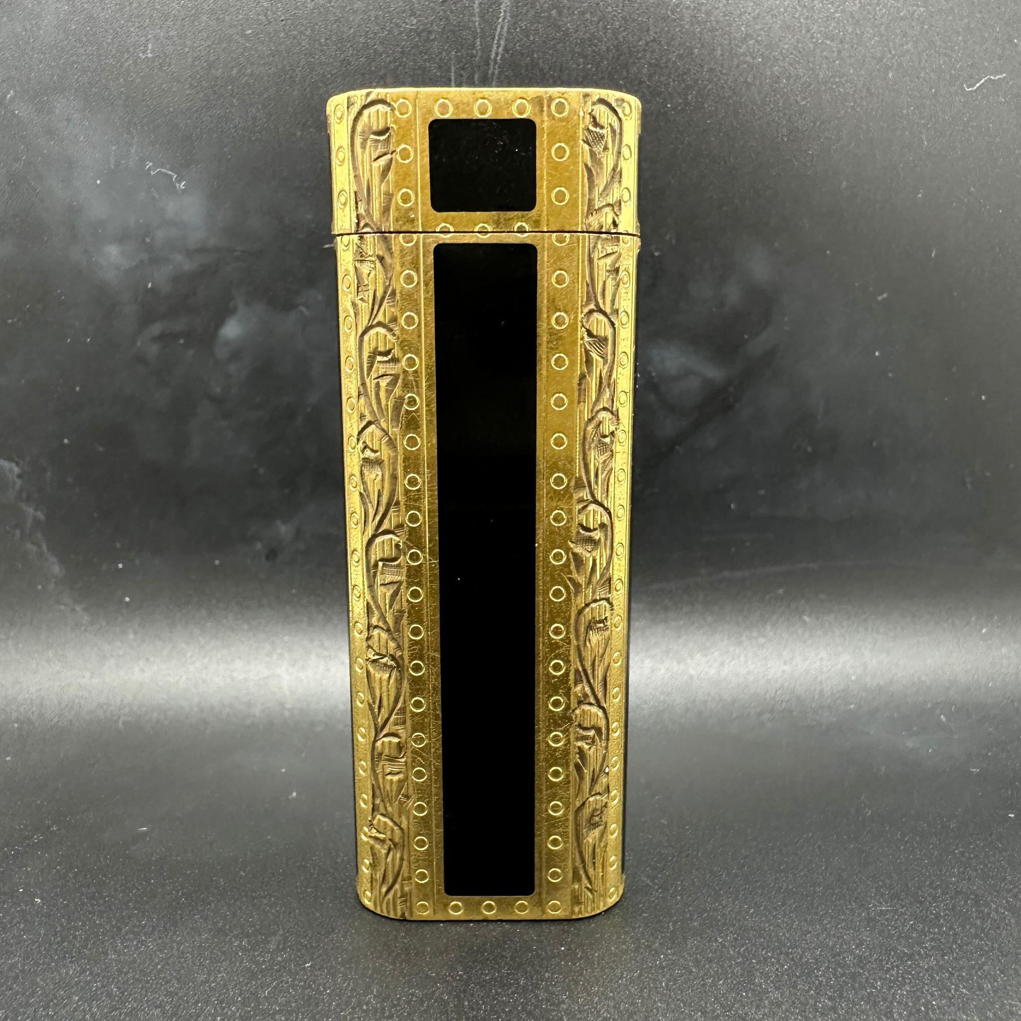 Beautiful Cartier Royking lighter.
CARTIER  RoyKing Rollagas, a Unique RARE example of a ROYKING designed Cartier Rollagas lighter made circa 1970's, Gold with Baroque lacquer, 
Baroque design,
mint condition,
Roy King emblem on top side part of