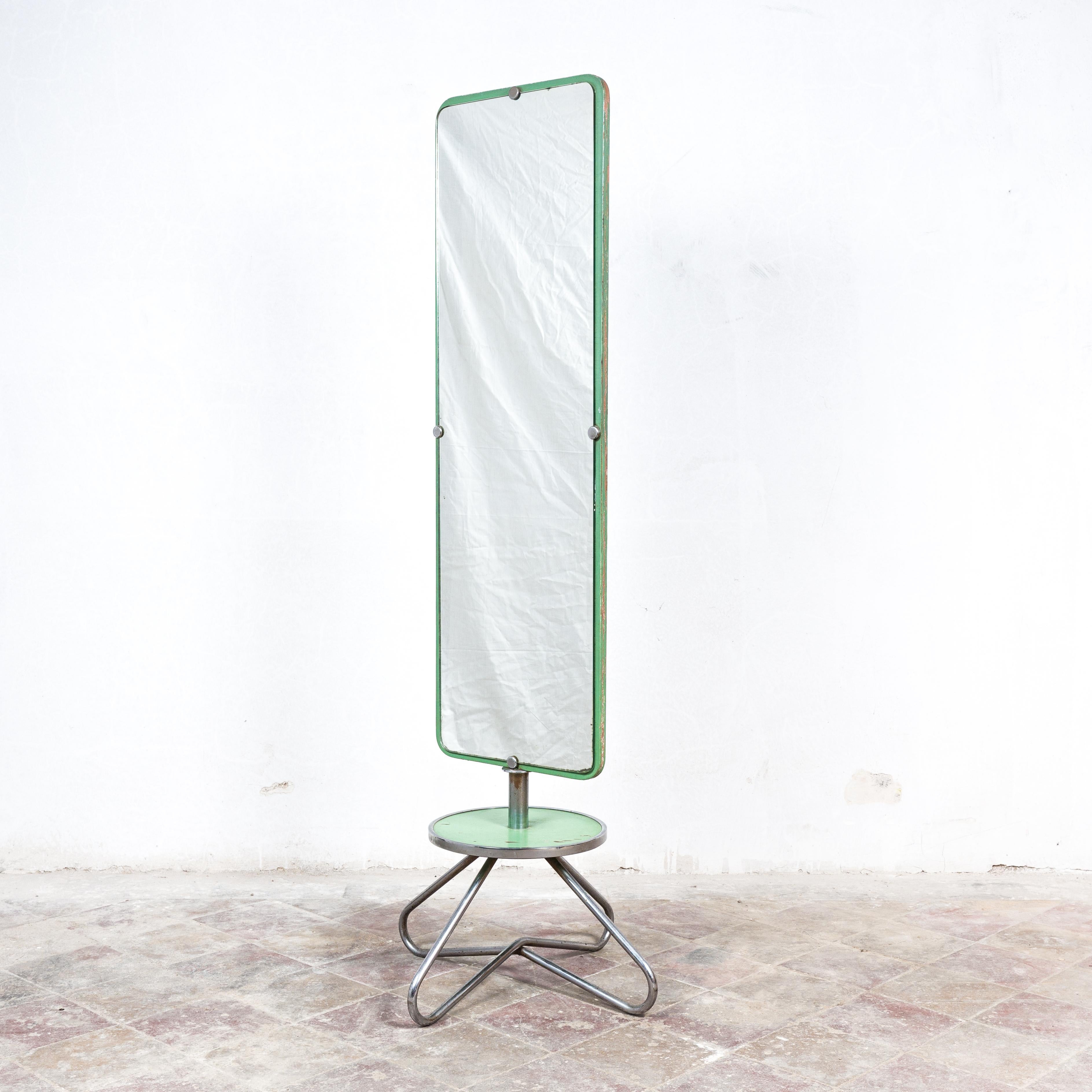 Unique and extremely rare functionalist mirror, catalogue no. 1266. Manufactured by Vichr and Co. Prague, former Czechoslovakia in 1930's. Chrome plated tubular steel, cut mirror, plywood. Height 175 cm, mirror 40 x 130 cm. In good original