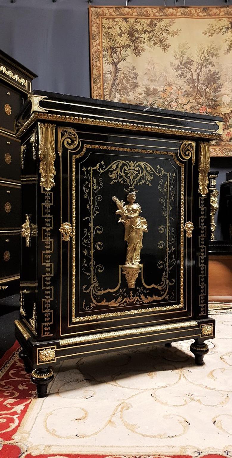 Extremely Rare Cabinet in Boulle Marquetry with gorgeous Brass ornementations and very important Gilt Bronze ones.
You will find on the door, the beautiful Bronze representation of the Goddess Ceres, the Godess of Fertility and Motherly