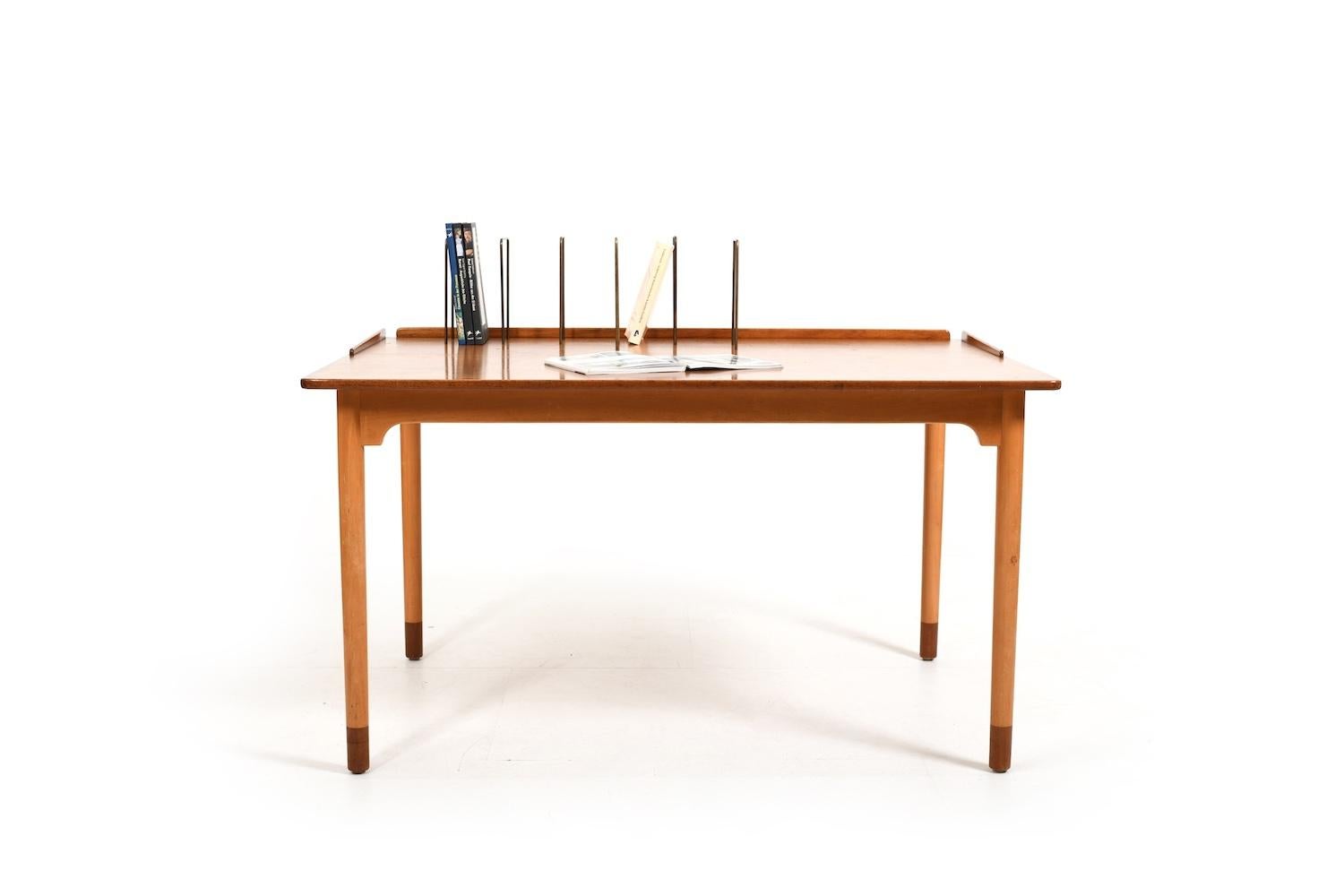 Very rare Børge Mogensen desk / library table in teak and beech. Designed in 1940s and produced by FDB Møbler Denmark. Desk plate and end of legs in teak. With brass bookholders, that can be freely plugged in. C.1950. Note: the last photo is a old
