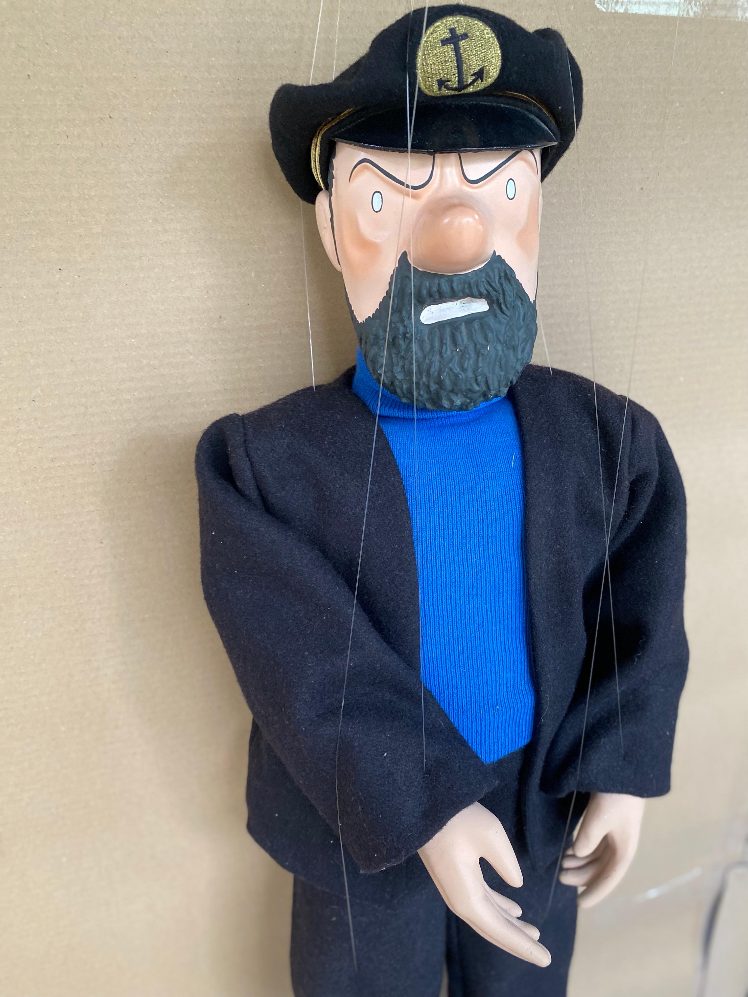 Very rare Captain Haddock puppet
HERGÉ, Georges Remi dit (1907-1983)
Leblon Delienne
1986
Dimensions: h80 x w36 x d5 cm 
Wool / leather / resin
Very good condition, 300 copies, 
signed on the neck. 
145/300
Price: 1400 €.