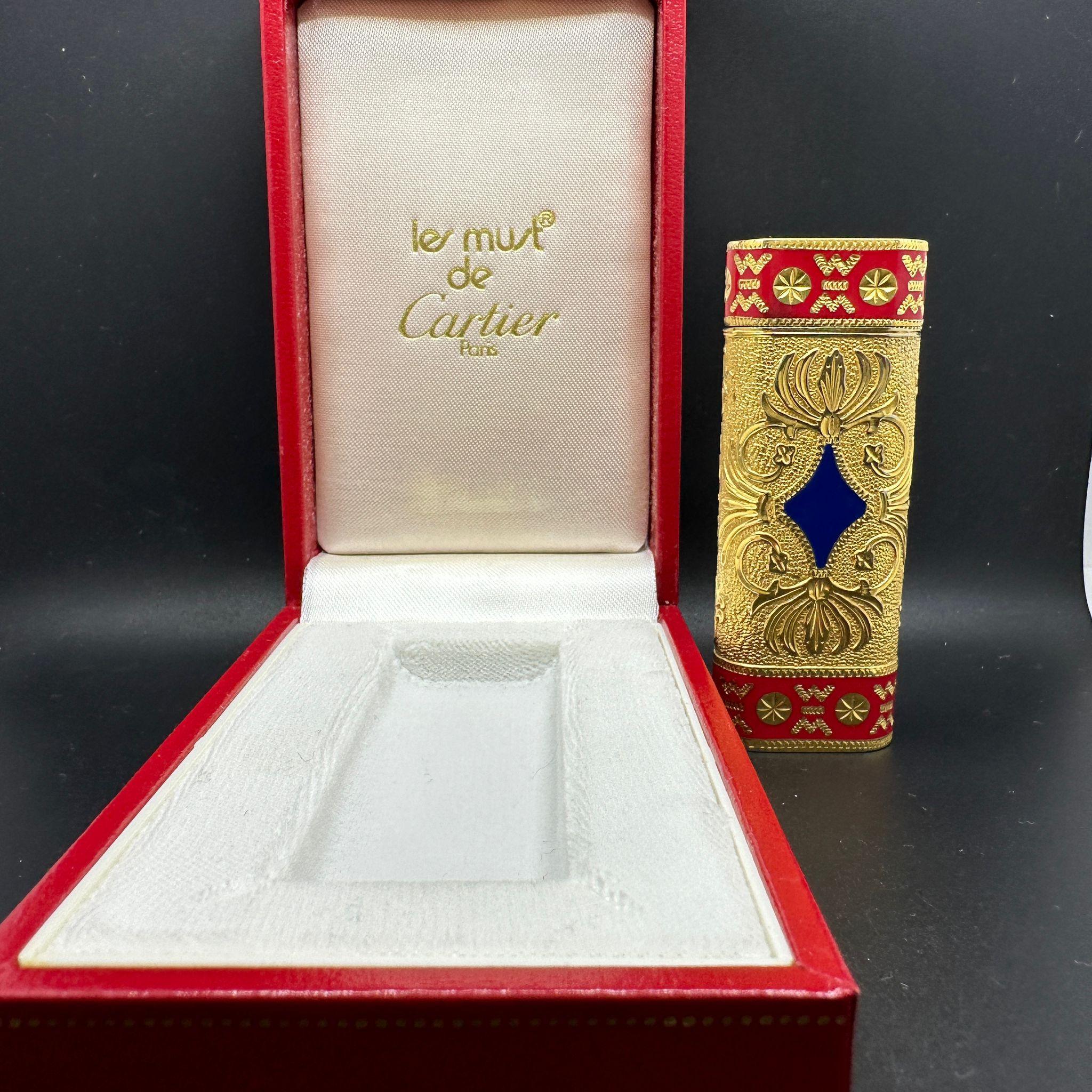 Cartier “Royking” lighter.
Circe 1970
CARTIER  Roy King Rollagas, a Unique RARE example of a ROYKING designed Cartier Rollagas lighter made circa 1970's, 18K Gold Baroque Inlay with Red and Blue lacquer, mint condition.
Roy King emblem on top side
