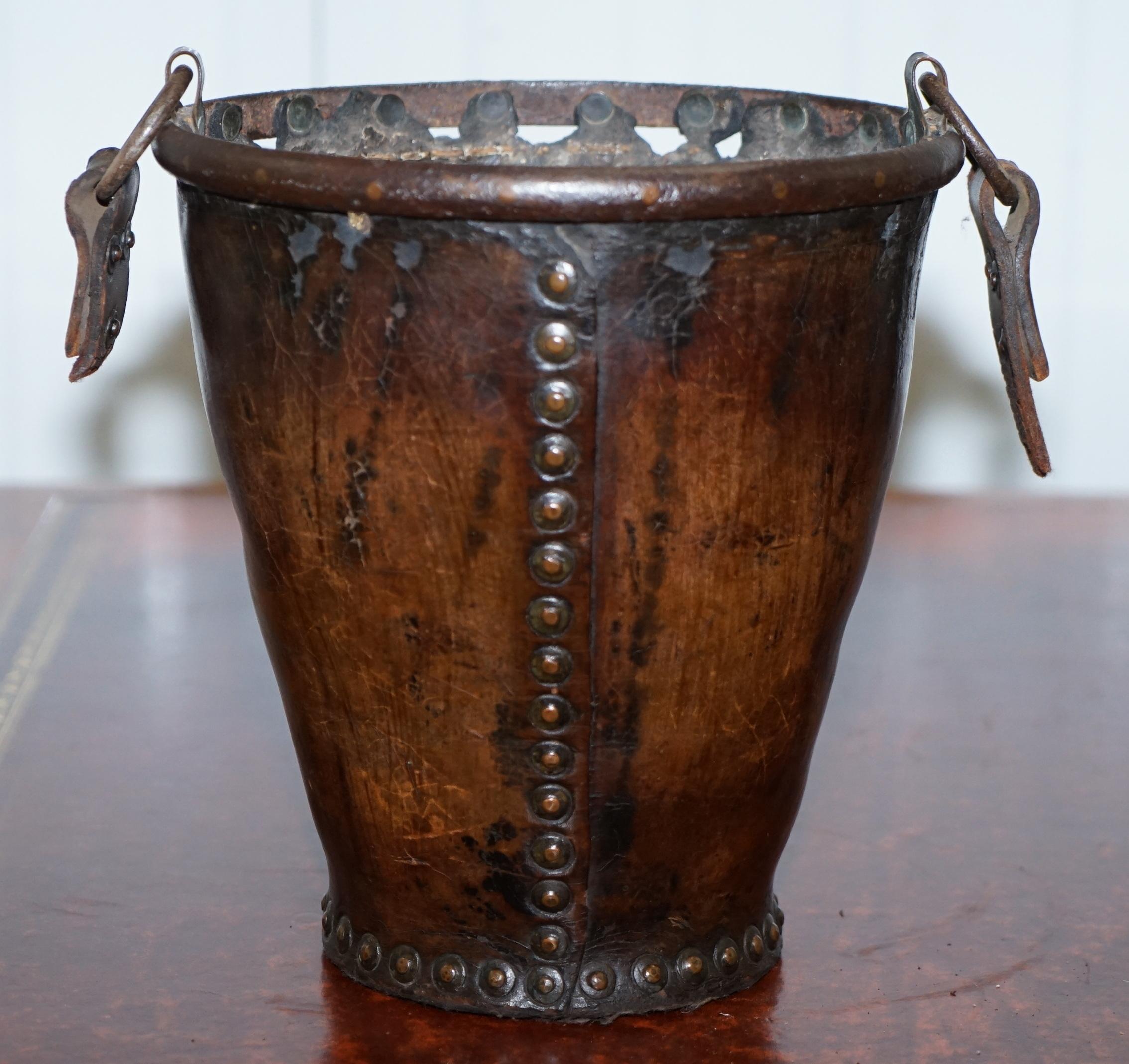 We are delighted to offer for sale this stunning original circa 1740 iron and leather bound fire bucket with original handle

I have another which is circa 1800 listed under my other items

A very decorative and well made piece, nearly 300 years