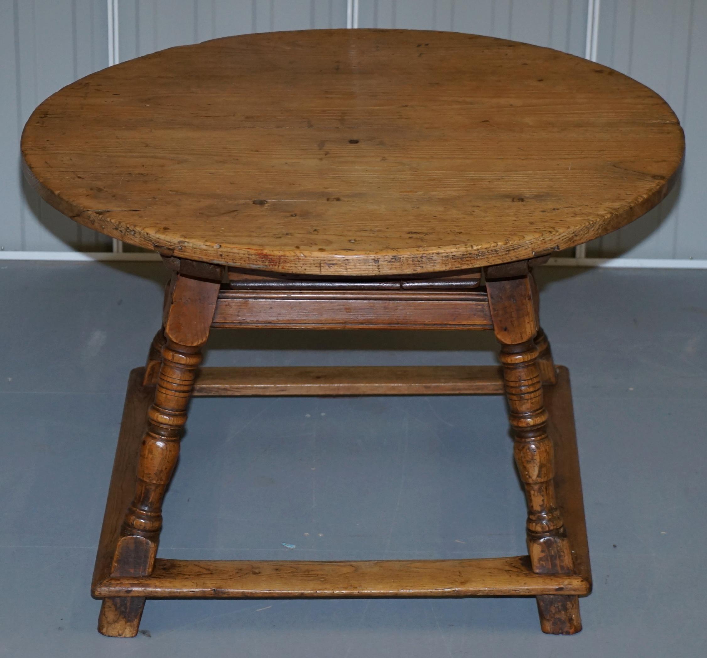 We are delighted to offer for sale this lovely original circa 1780 solid pine farmhouse country round dining table

A very good-looking piece, it has traces of original paint around the base and legs, its very nice size that seats four people