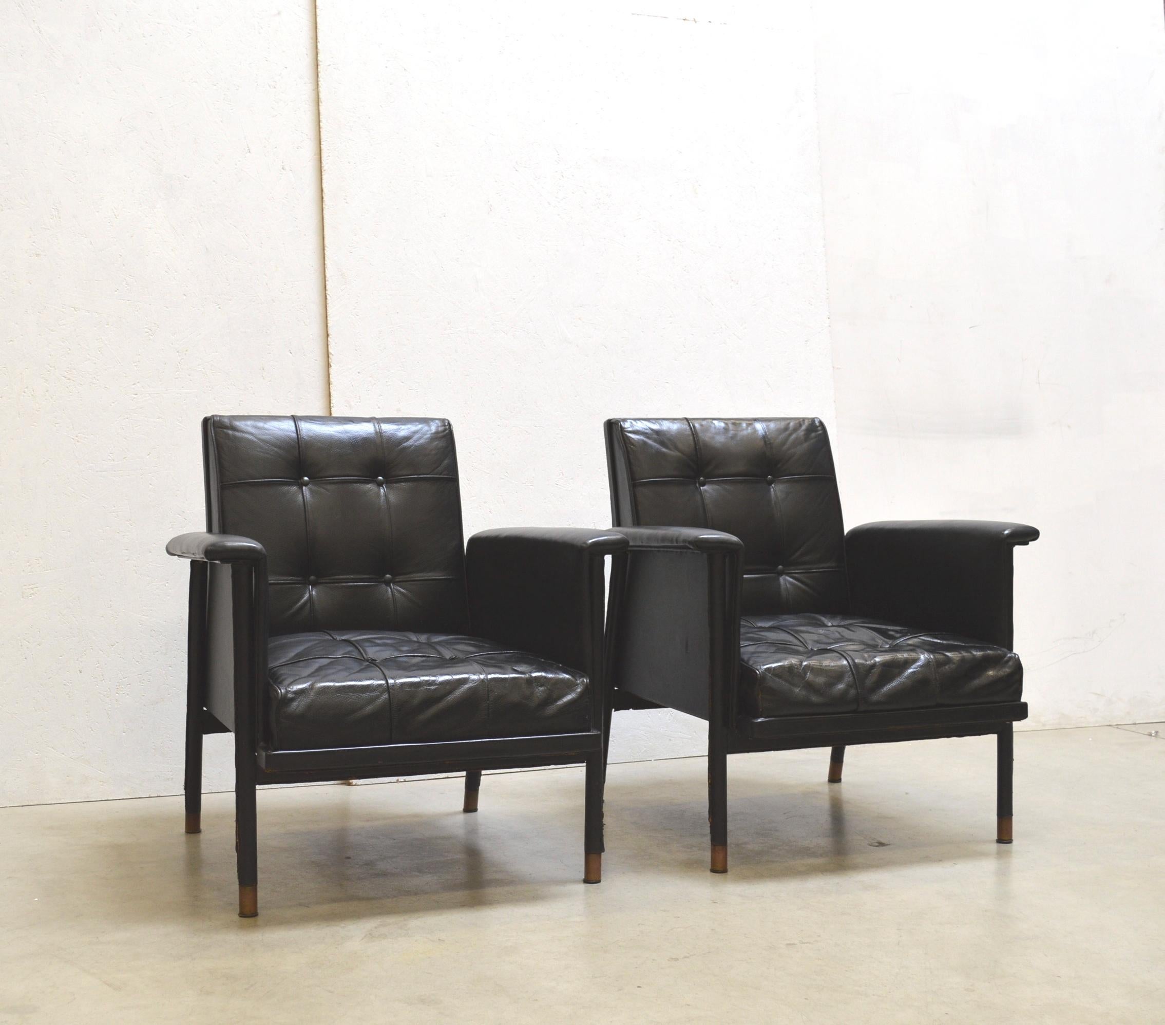 Very rare and fine armchairs by Jacques Quinet. Made in France in the early 1960s.
Fine black leather upholstery. The feets comes with brass encased legs.

Stunning pieces. Nice vintage condition with usual kinds of useage.

Literature: