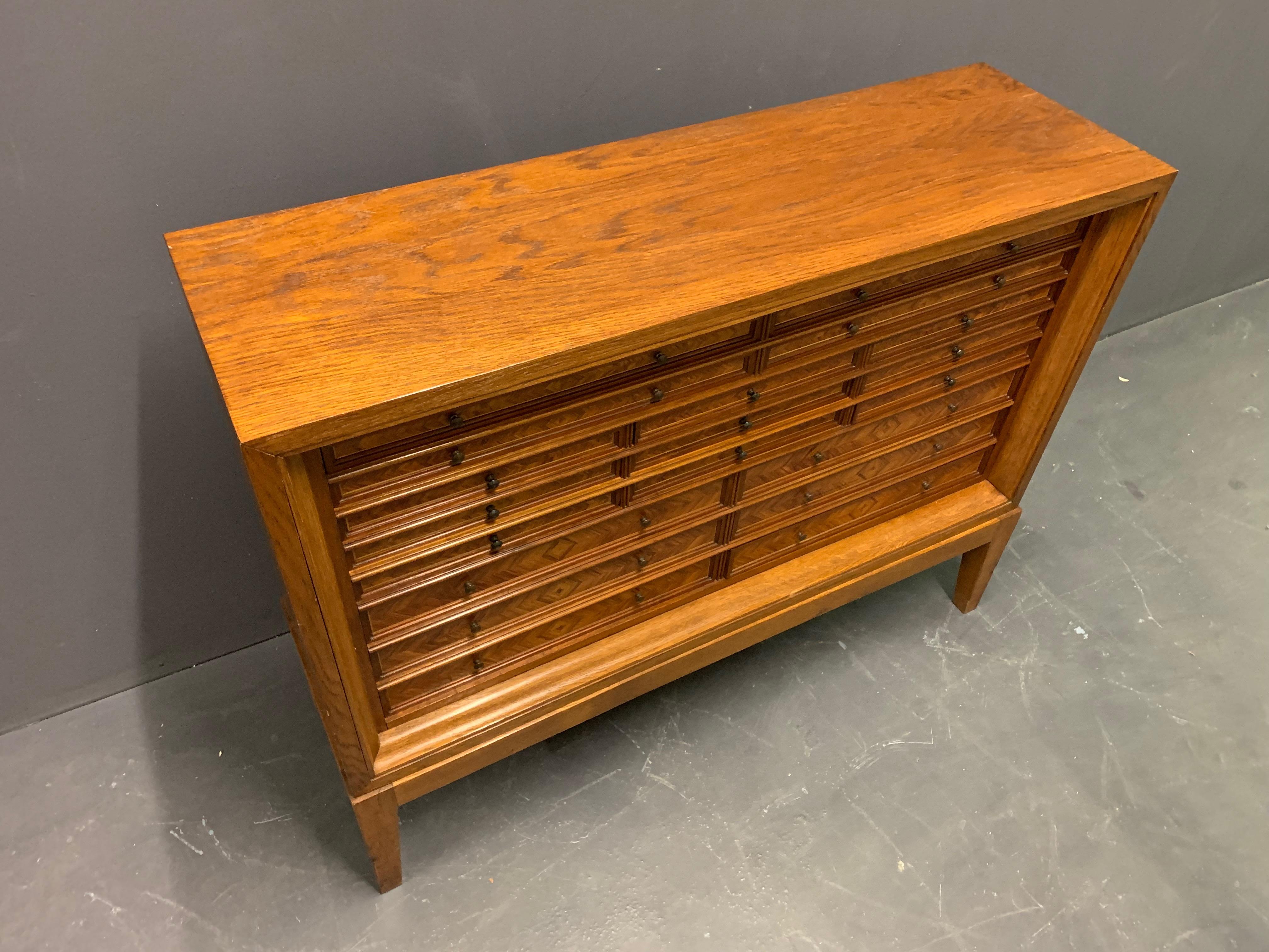 By unknown cabinetmaker. Oak and walnut veneer with various drawers. All lined with velvet.