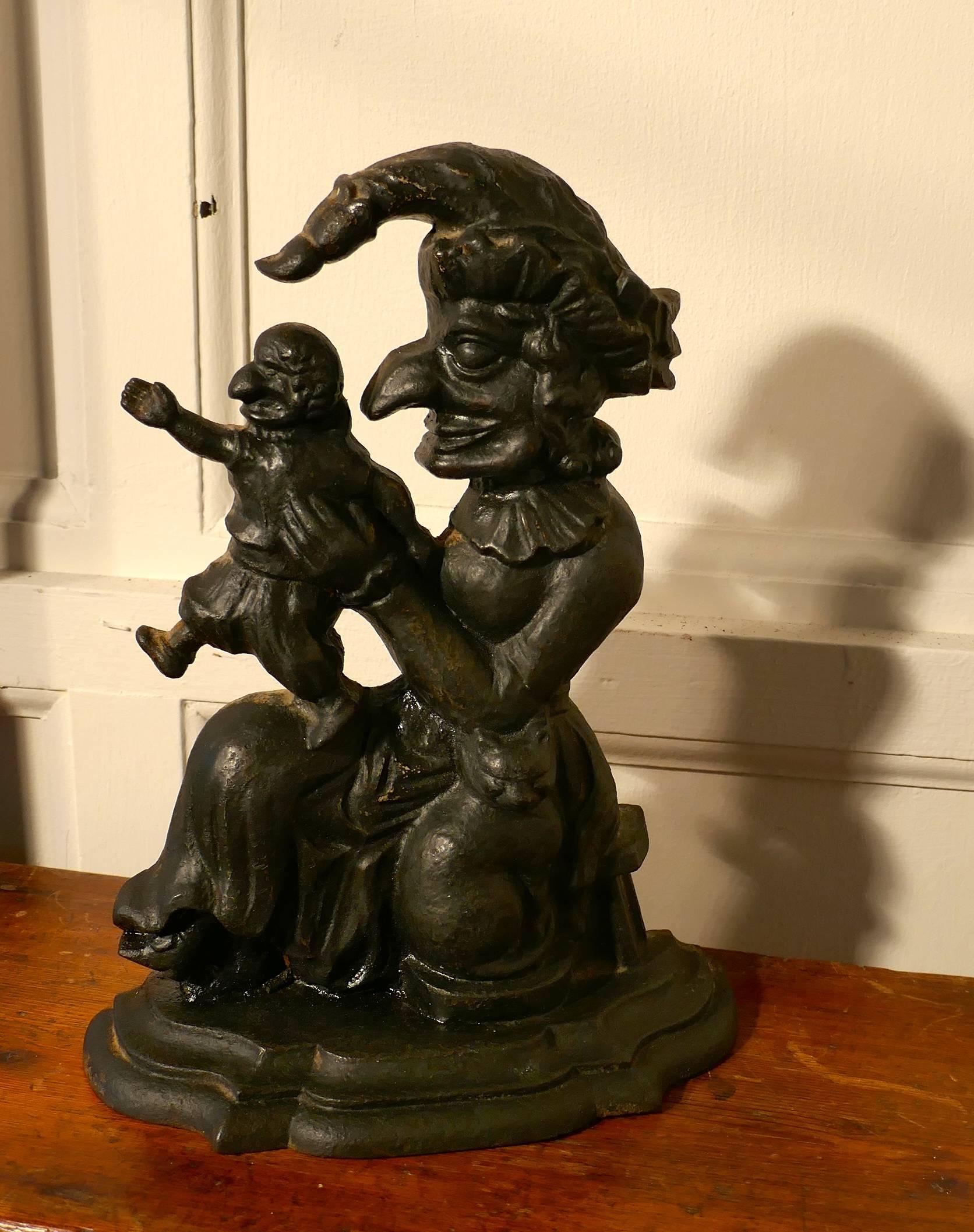 Very rare early 19th century cast iron Judy door stop

This is a very rare piece, we have Judy holding a very angry looking baby Punch
This is an original early 19th century piece and very different from the better known late 19th century