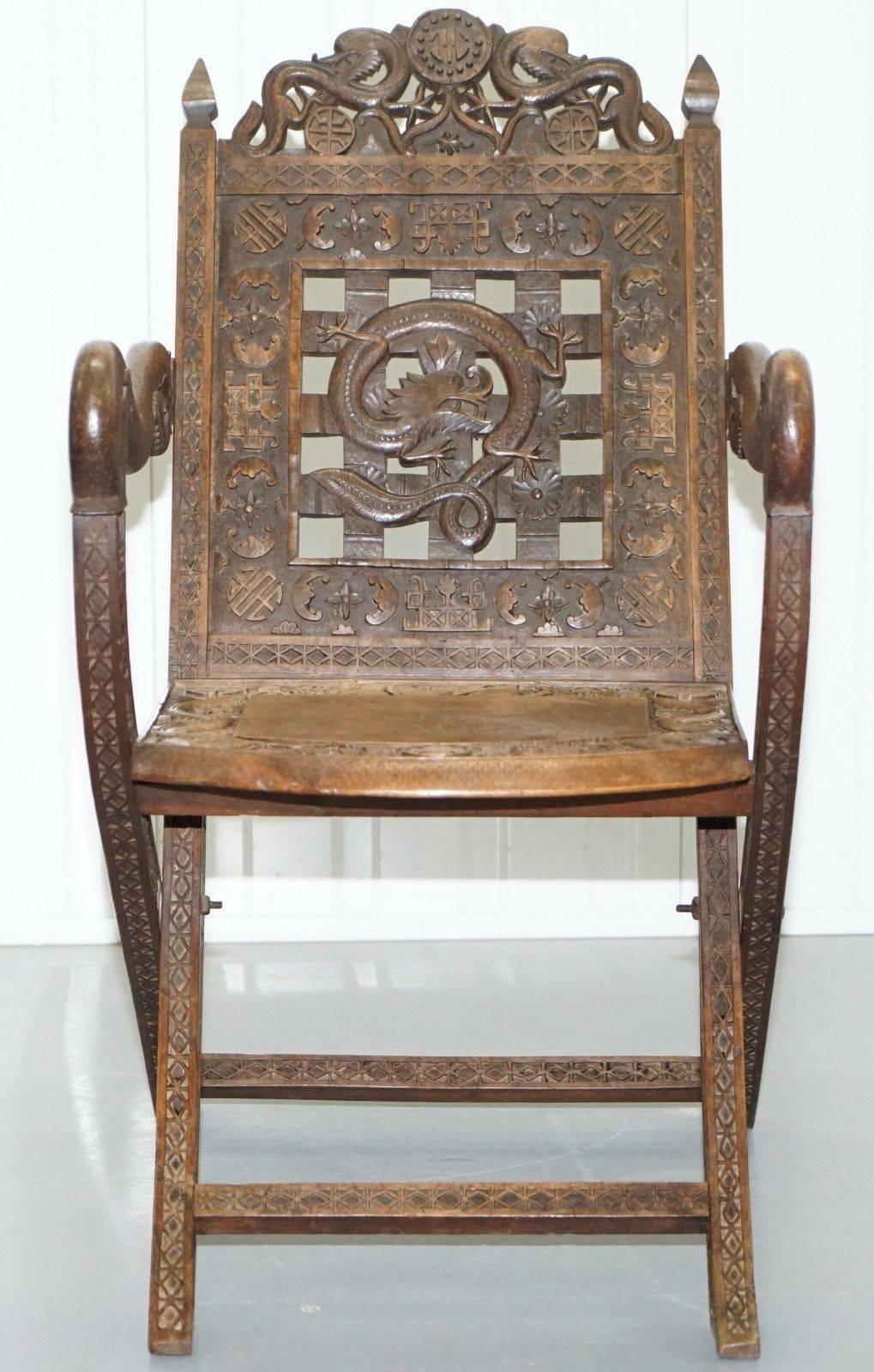 We are delighted to offer for sale one of the finest and most detailed hand-carved wood Chinese armchairs I have ever seen depicting dragons and bats

A rare find, almost every square inch of this chair is hand carved, dating to the early 19th