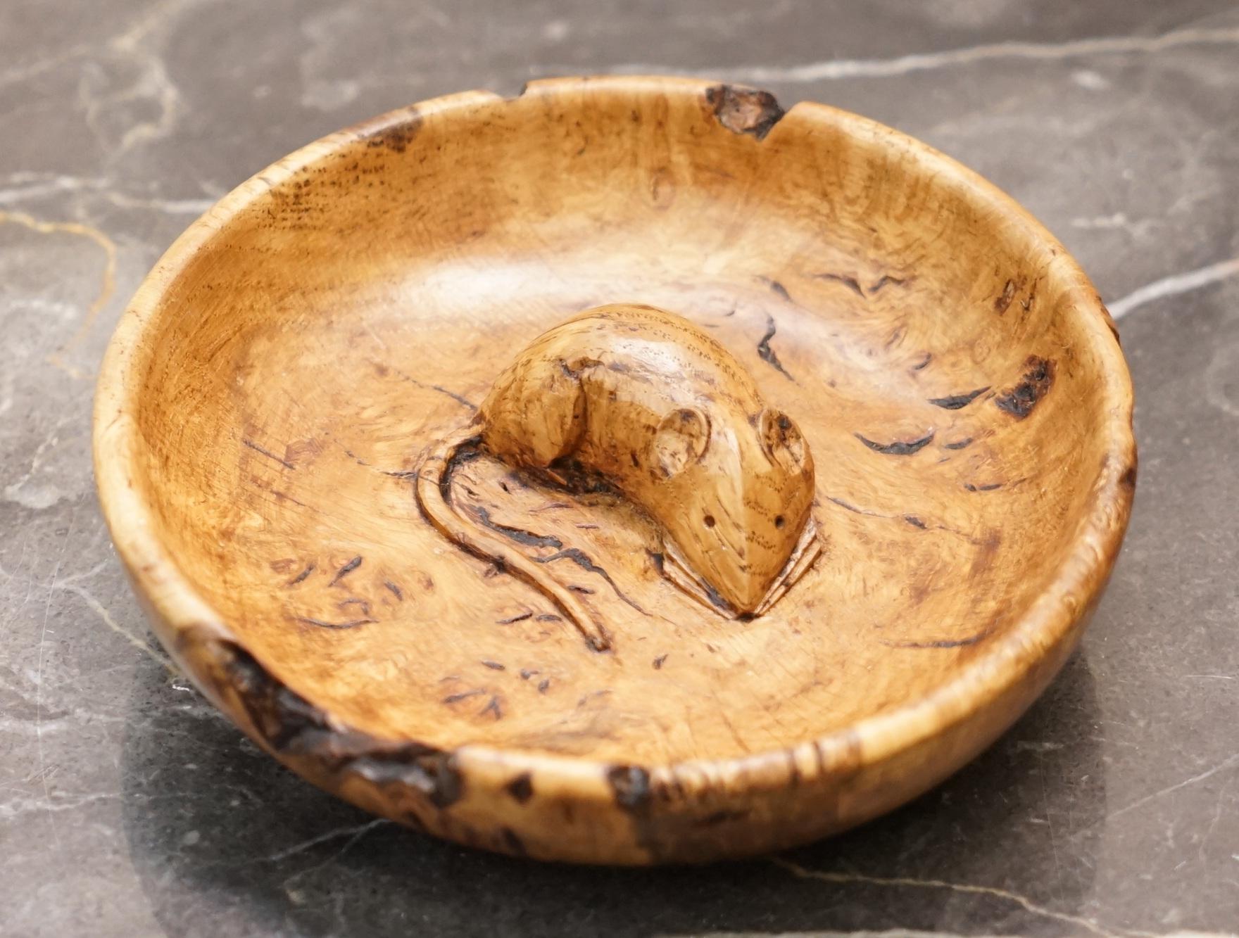 We are delighted to offer for sale this stunning early Robert Thompson Mouseman bowl made from a single Oak Burr

This is a rare and highly collectable piece of Mouseman tableware, ideally suited as a pin coin or key bowl, possibly for nuts, I