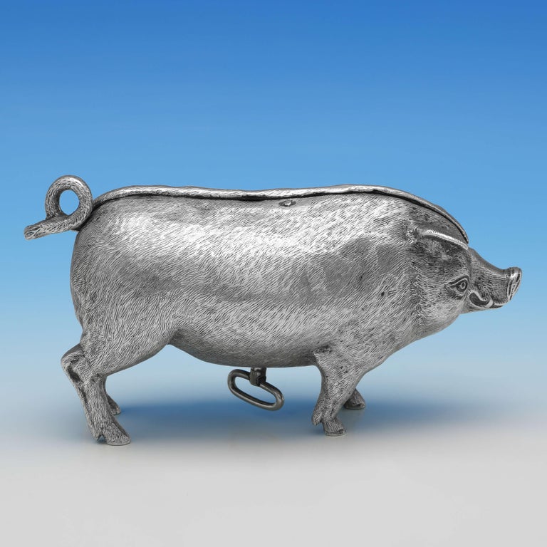 Hallmarked in London in 1904 by William Hornby, this wonderful and very rare, antique sterling silver bell, is modelled as a quite charming pig. The bell is operated by winding the key underneath and then pressing either the nose or the tail. The