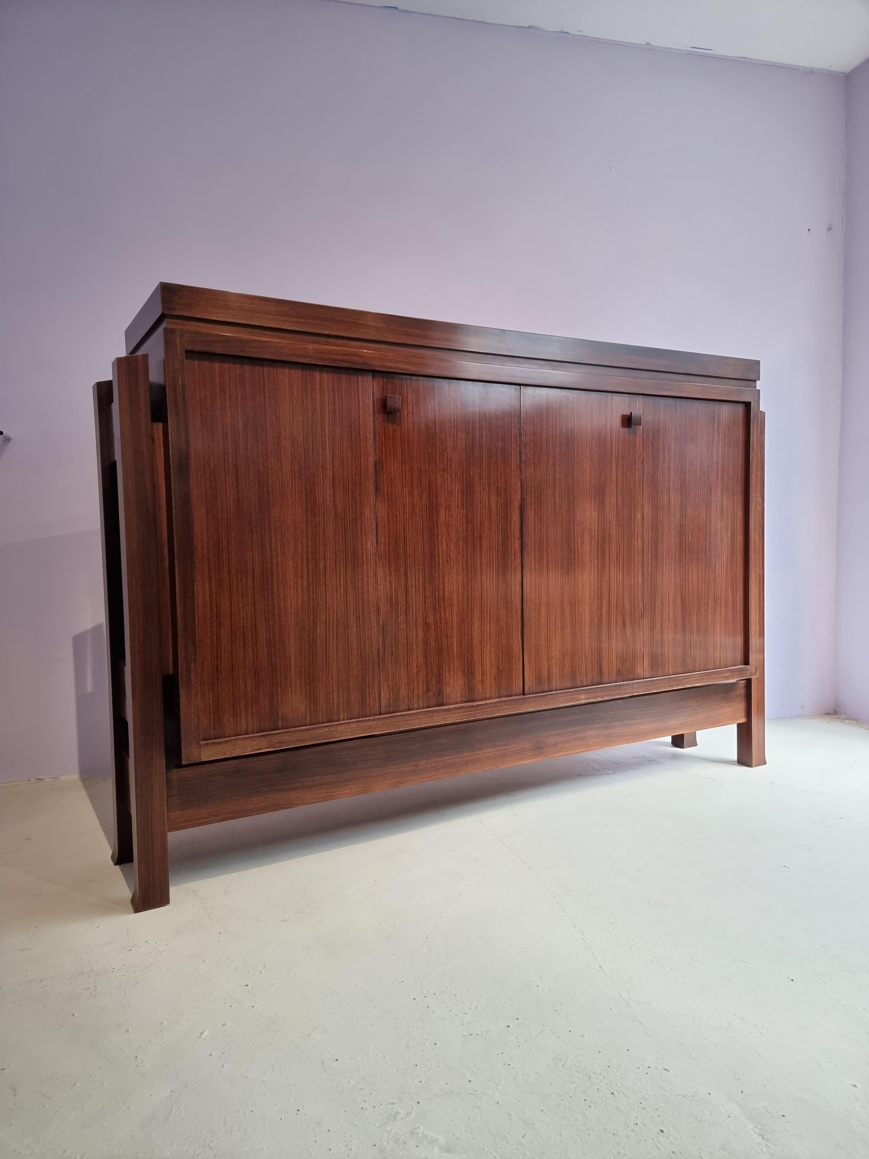 Emiel Veranneman, very rare oak wood, Belgium, 1960s
This monumental highboard cabinet features four doors with squared handles.

The cabinet is geometric and sculptural and at the same time holds plenty of storage space.
On the side of this