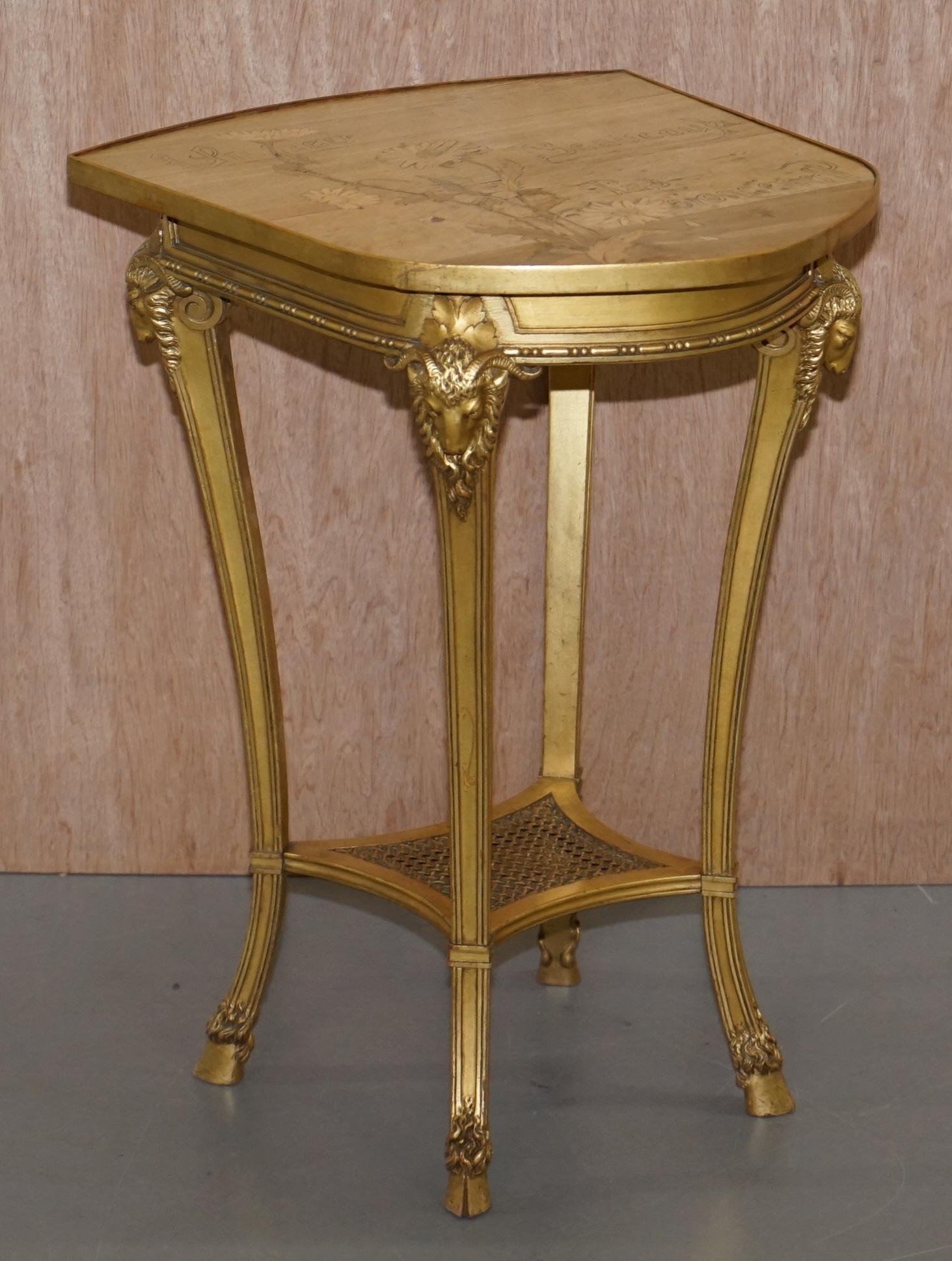 We are delighted to offer for sale this exceptionally rare Emile Galle signed occasional table with gold Giltwood Rams head base and sample wood floral table top reading 