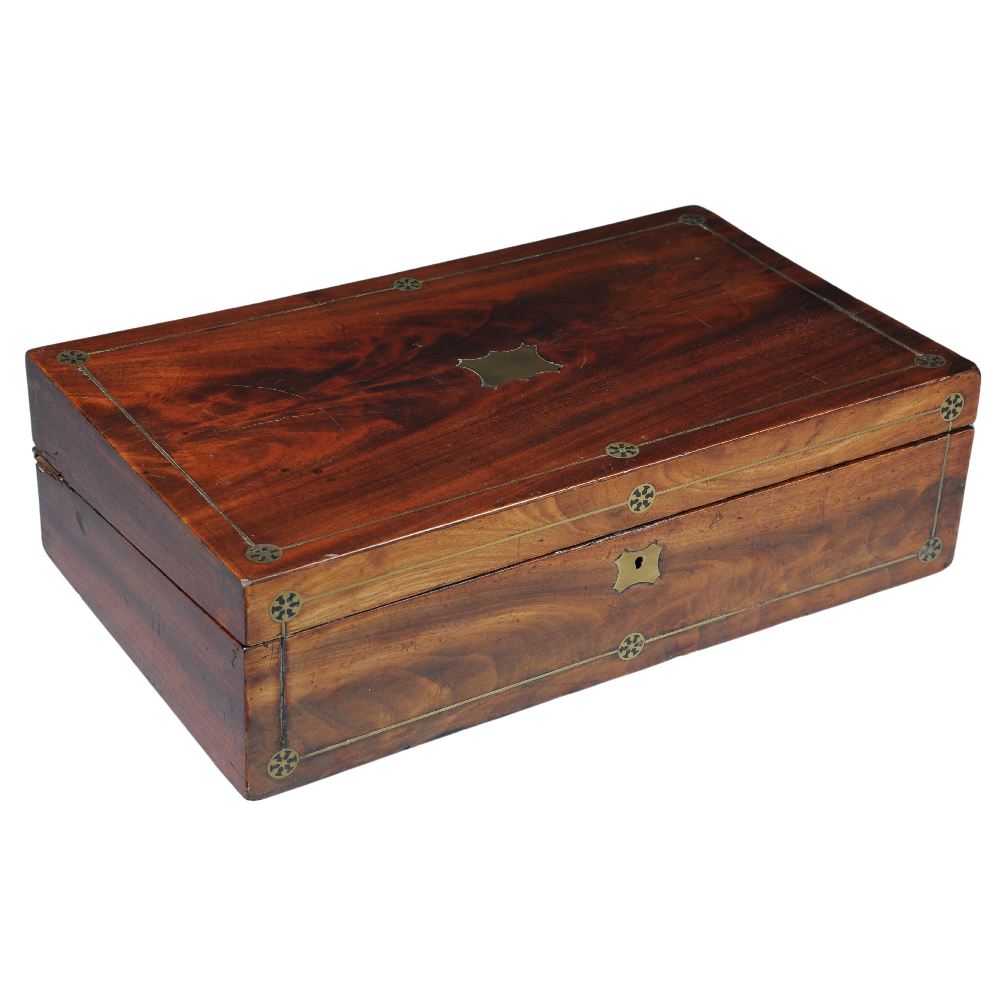 Very rare English travel writing desk/secretary chest around 1860

Solid mahogany lidded box that can be converted into a travel writing desk/travel secretary with a green leather top and gold embossing. Storage compartments for writing utensils