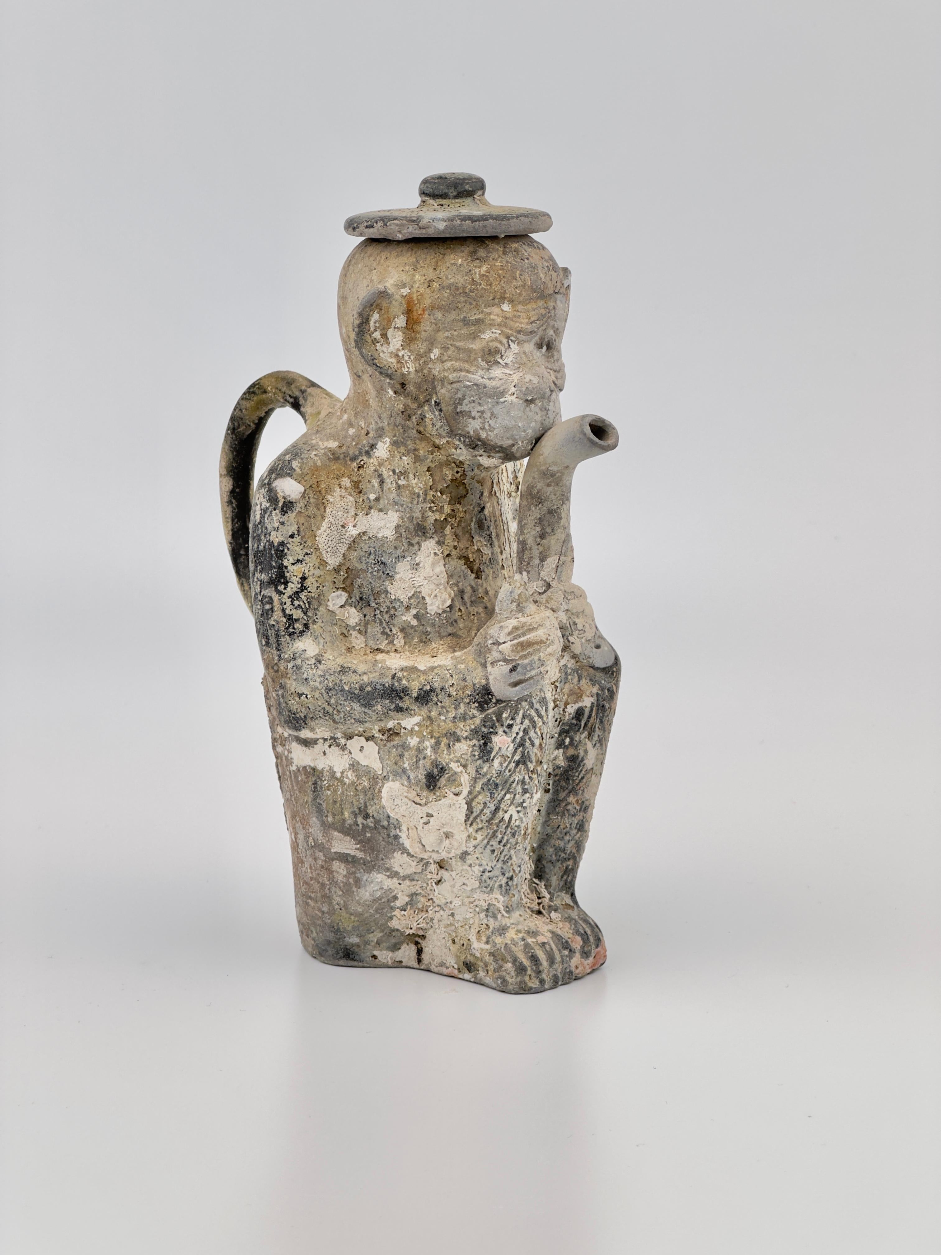 This statue is a representative piece excavated from the Ca Mau shipwreck. It is featured on the cover of the collection book by Dr. Zelnik. Ewer and cover in the form of a seated monkey. With face and hands unglazed, and a short curved spout cupped