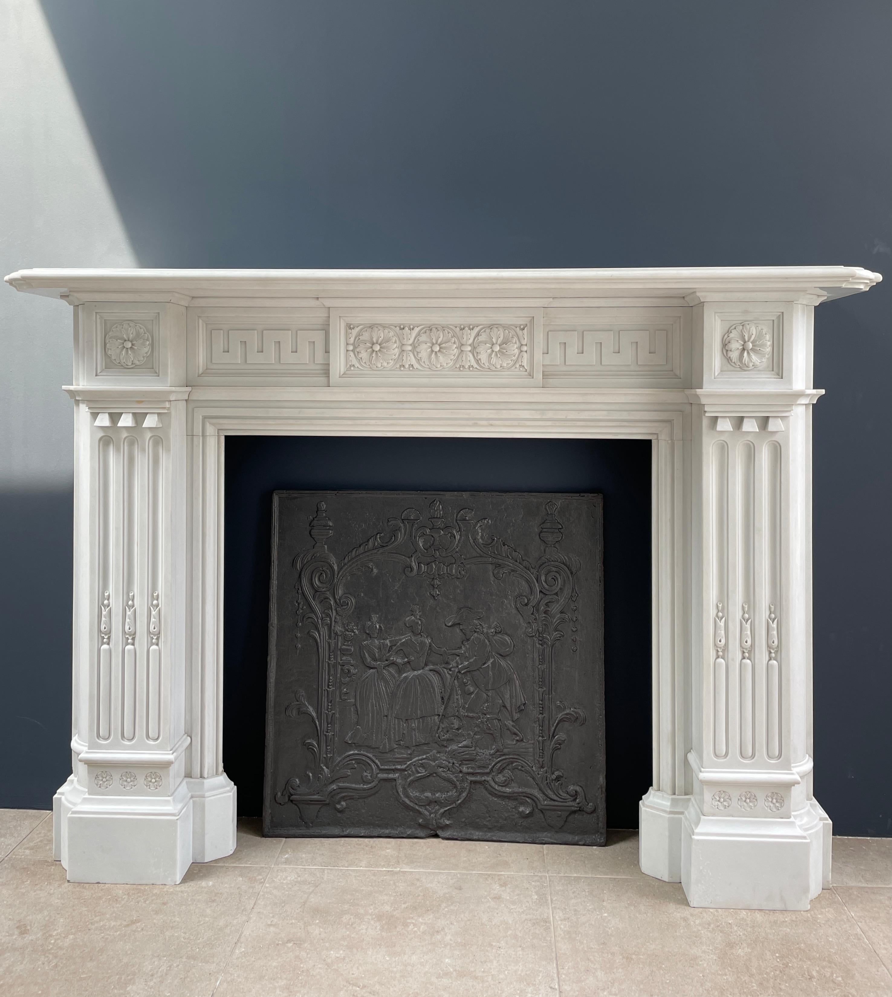 This exceptional Statuary marble fireplace is an absolute gem. 
This Statuary is an Italian marble type. This particular piece of marble is totally whit out veins.
The same marble used to craft Marble statues. 
due to the hardness of this type of