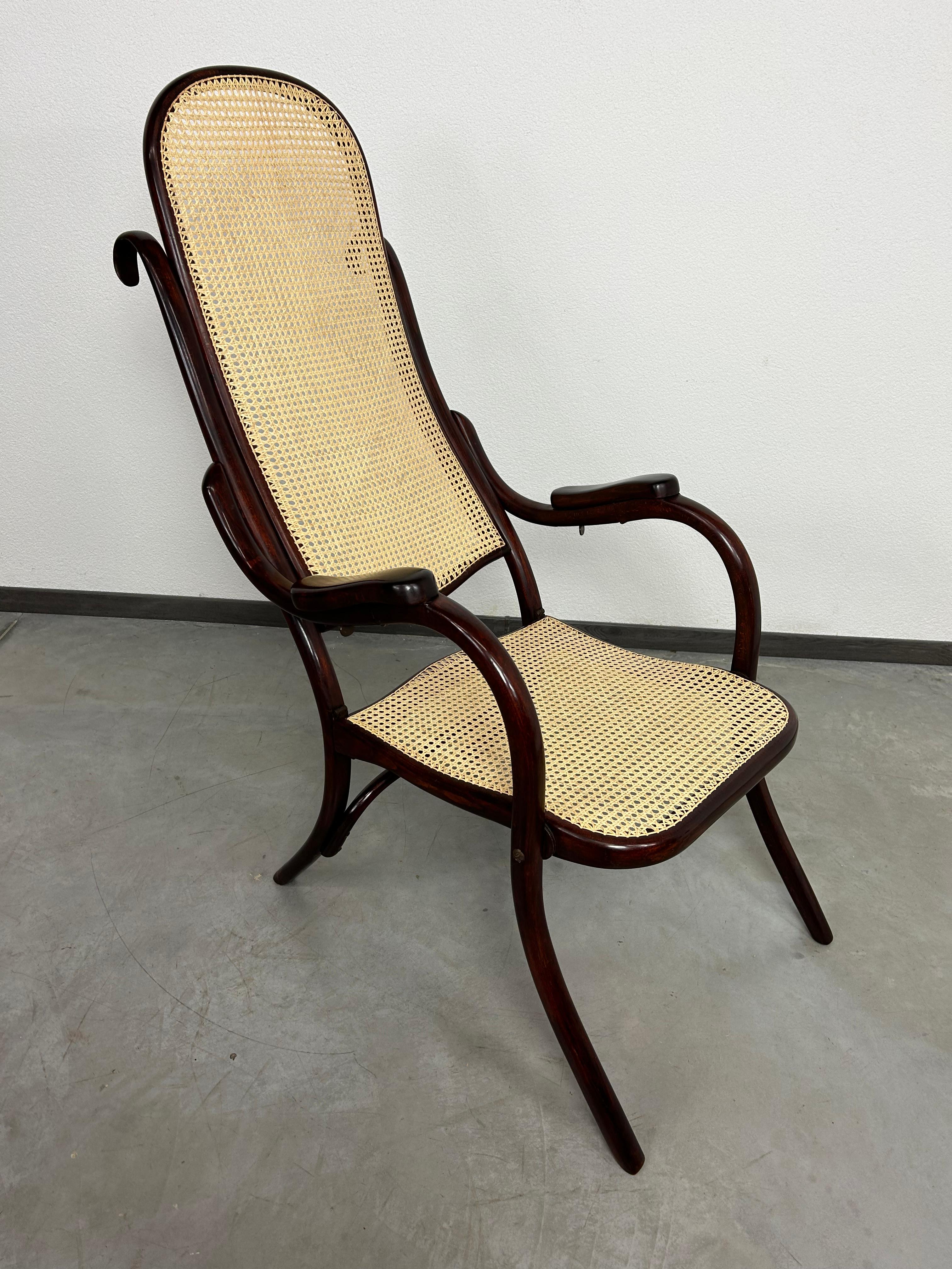 Very rare folding easy chair no.1 by Thonet professionally stained and repolished with new handmade rattan seat.