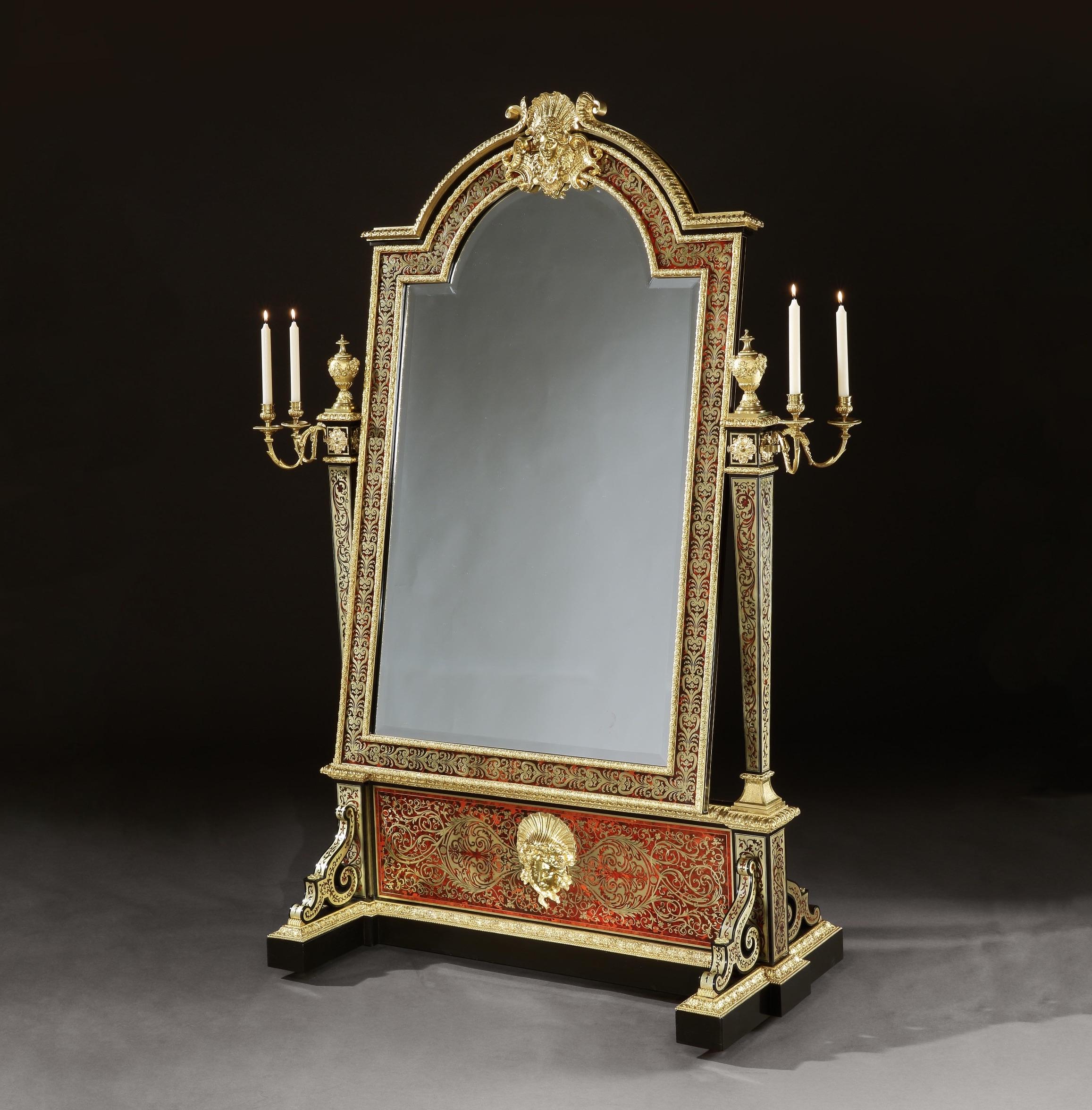 An extraordinary Boulle Marquetry inlaid cheval mirror
in the Louis XIV Manner

Constructed from bois noirci and dressed with fire gilded bronze mounts throughout, the surfaces decorated and adorned with tortoise shell and brass marquetry in the