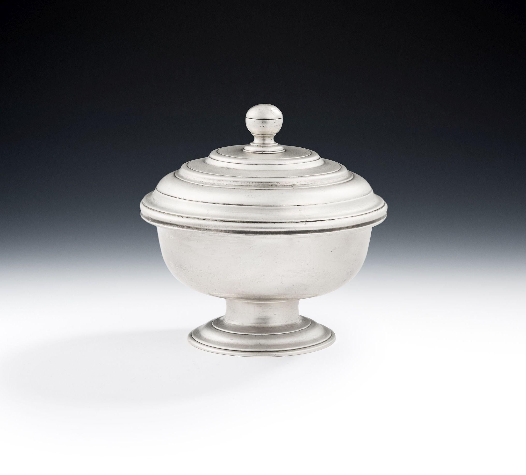 A Very Rare and Unusual George II Bowl and Cover Made in London in 1746 by Gabriel Sleath.

The Bowl is modelled in a very unusual design and stands on a spreading pedestal foot decorated with reeded bands.  The shallow circular main body has a