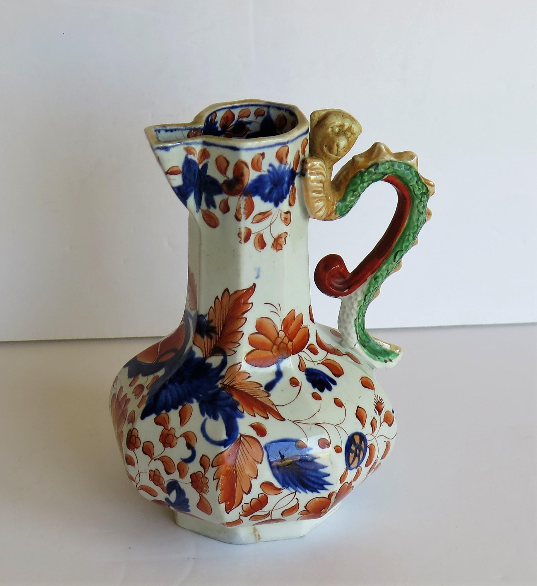 This is a fine and very rare, ironstone pottery jug or pitcher with an elongated neck made by Mason's Ironstone, of Lane Delph, Staffordshire, England, circa 1820.

The jug is octagonal in section with a low foot and an elongated neck having a