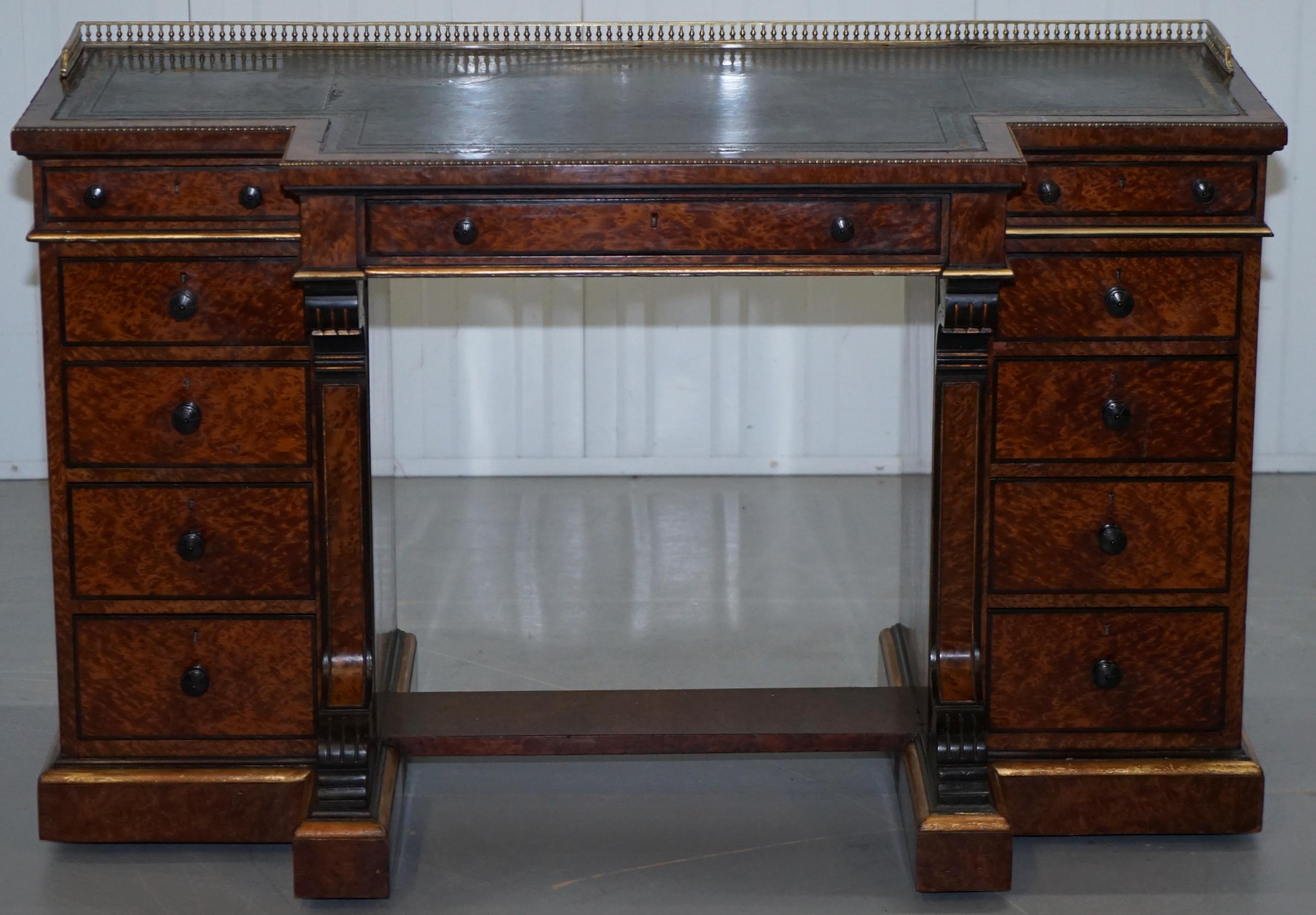 We are delighted to offer for sale this stunning and exceptionally rare Gillow Library breakfront desk with brass gallery in Burr Amboyna timber, circa 1852-1857

An exceptionally rare example of a high Victorian Library desk made by one of the
