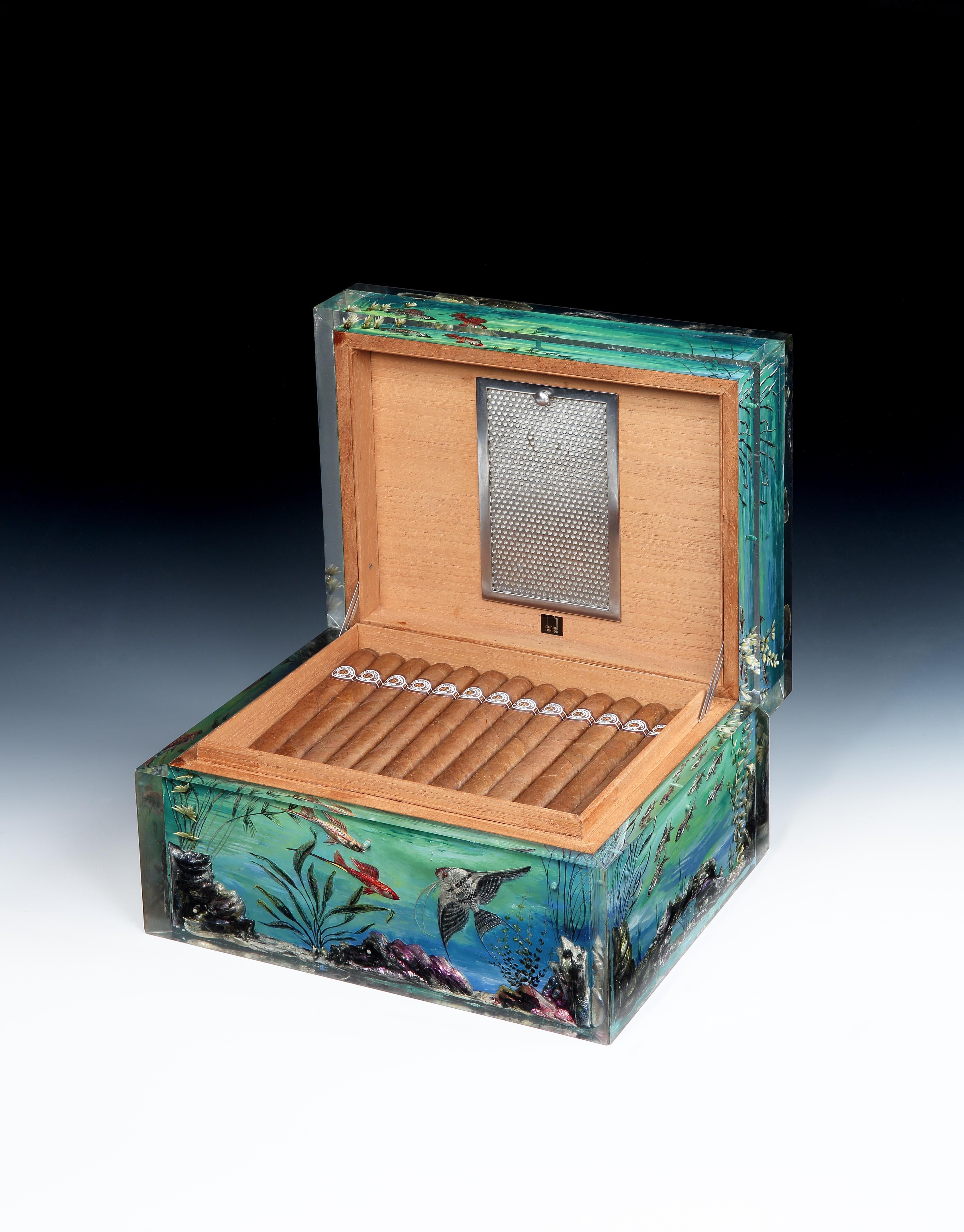Alfred Dunhill, London

Of extraordinary quality, this beautifully hand-painted 'Aquarium' humidor was a special order collaboration for Dunhill, between Ben Shillingford and watercolour artist Margaret Bennett and features beautifully painted