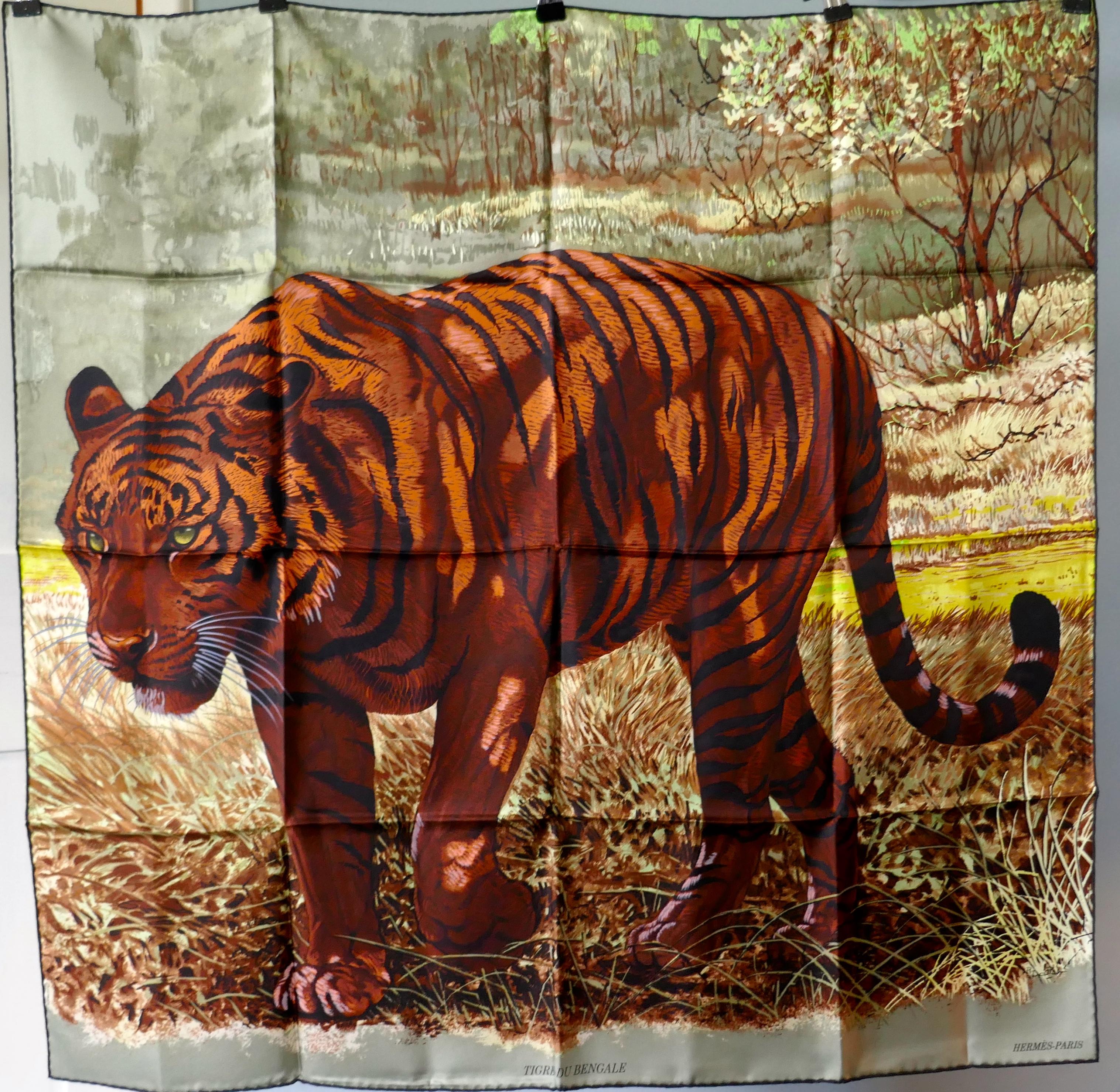 Very Rare Hermes Silk Scarf “Le Tigre du Benagale” by Robert Dallet

Beautiful unworn 100% Silk Hermes Scarf  “Le Tigre du Benagale”  by by Robert Dallet
This is an exquisite and stunning Grey and Red Ochre Colourway, one for the collector, portrait